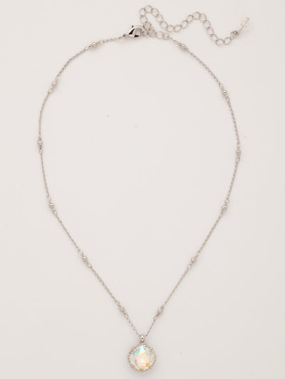 Cushion-Cut Pendant Necklace - NDS50RHCAB - <p>Elevate your jewelry collection with this artisanally handcrafted pendant necklace. The solitaire 12mm cushion cut crystal is surrounded by a beautifully scalloped edge, creating a unique and eye-catching design. The little ball details along the chain add a touch of character. This adjustable necklace features a 16 inch chain with a 4 inch extension, complete with a delicate charm, for a versatile fit. Whether you're looking for a special gift or a treat for yourself, this handcrafted necklace is a stylish and timeless choice.</p>