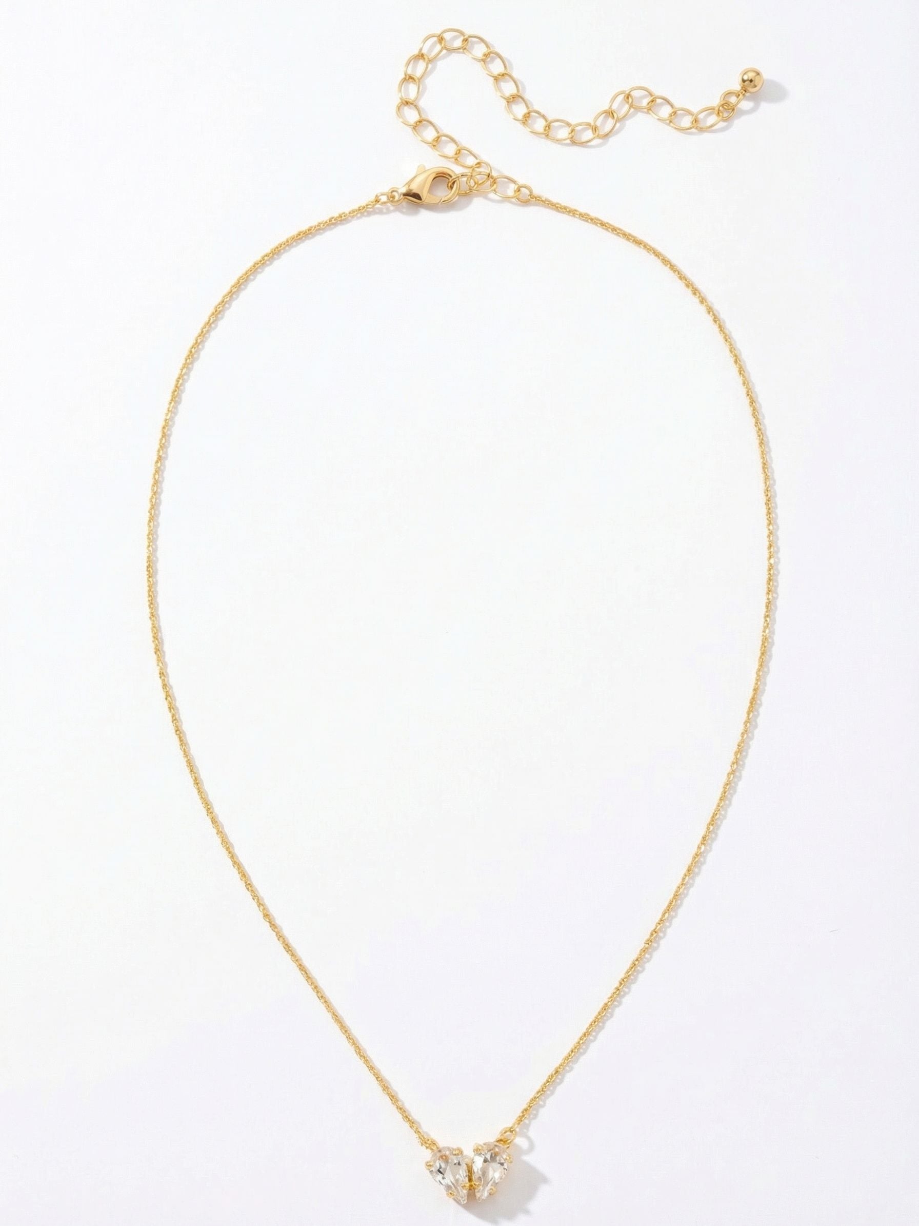 Marlowe Pendant Necklace - NEM11BGCRY - <p>A fine cable chain anchors two pear-cut clear crystals angled gently together, resting weightlessly at the collarbone. The slender construction catches the light softly, offering a quiet hint of sparkle that transitions easily from morning errands to evening dinners. An adjustable extension chain lets you fine-tune the drop, ensuring the pendant sits exactly right whether paired with an open collar or a simple crewneck.</p><ul>
<li>Twin pear-cut crystals arranged in a subtle angled motif</li>
<li>Fine cable chain designed to rest seamlessly against the skin</li>
<li>Lobster claw clasp</li>
<li>4-inch adjustable extension chain</li>
<li>Protective e-coat finish for lasting wear</li>
<li>Includes signature organza pouch for gifting and travel</li>
</ul>