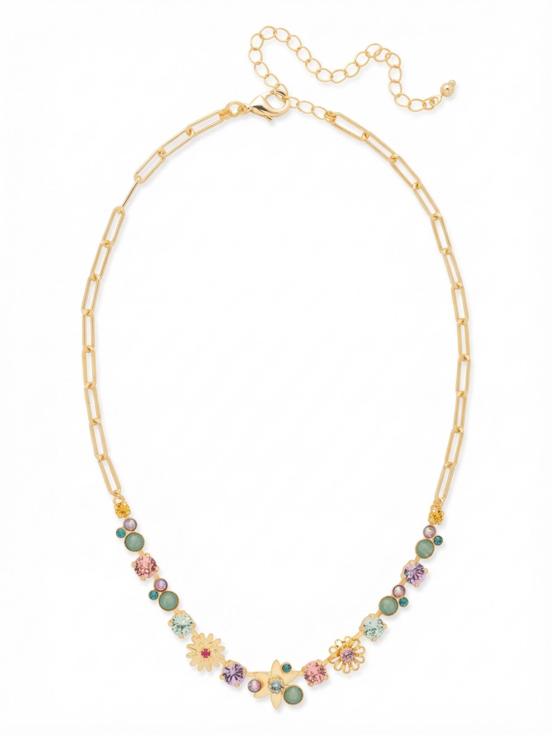 Meadow Tennis Necklace - NEV130BGCPO - <p>Bright gold paperclip links offer a sleek contrast to the botanical cluster resting at the collarbone. The front-facing design transitions from polished chain into an asymmetrical gathering of metal blooms and round-cut crystals in soft violet, pacific opal, and aquamarine. Sitting high on the neck, this piece provides a focal point of varied pastel light. It easily anchors a layered look, while the extension chain allows you to adjust the placement exactly where you want it.</p><ul>
<li>Asymmetrical mix of pastel stones and metal floral motifs</li>
<li>Modern open paperclip chain construction</li>
<li>Lobster claw clasp</li>
<li>4-inch adjustable extension chain</li>
<li>Protective e-coat finish for lasting wear</li>
<li>Includes signature organza pouch for gifting and travel</li>
</ul>