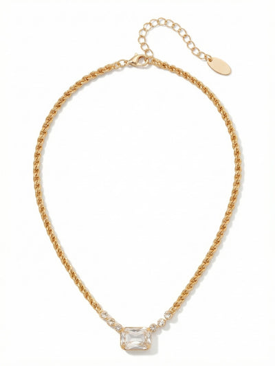 Kathleen Studded Pendant Necklace - NFF80BGCRY - <p>A substantial gold-tone rope chain transitions into a delicate line of small round crystals, framing a single, horizontally set emerald-cut stone. The weighty chain anchors the piece, allowing the large center crystal to rest evenly at the collarbone without twisting. It brings enough presence to anchor an open neckline on its own while layering easily with longer, finer chains. The built-in extension allows you to adjust the drop to suit whatever collar you are wearing.</p><ul>
<li>Textural contrast between the heavy rope chain and delicate crystal accents</li>
<li>Horizontally set emerald-cut crystal creates a modern architectural focal point</li>
<li>Lobster claw clasp</li>
<li>4-inch adjustable extension chain</li>
<li>Protective e-coat finish for lasting wear</li>
<li>Includes signature organza pouch for gifting and travel</li>
</ul>