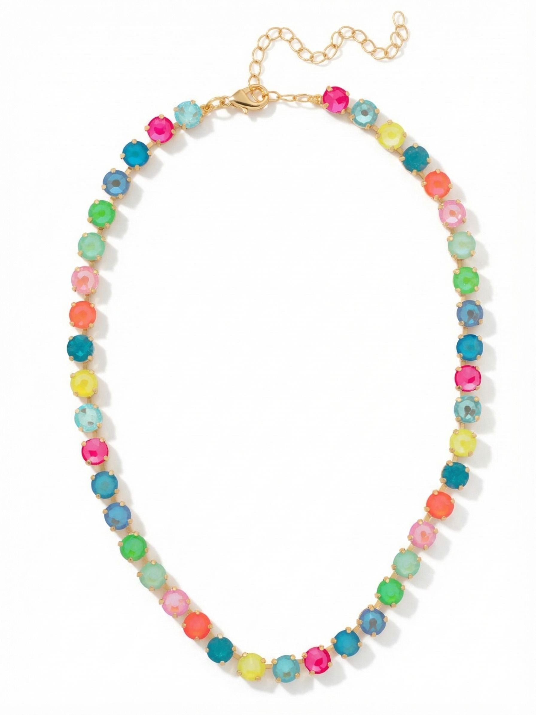 Matilda Tennis Necklace - NFJ4BGCCA - <p>A continuous line of highly saturated color curves right along the collarbone. The Matilda brings a vibrant spectrum of electric pinks, vivid greens, and ocean blues to a classic tennis profile. Built on a flexible kette chain, the round crystals drape fluidly and track the movement of your neckline. The bright gold setting adds distinct warmth to the energetic palette. With the included extension chain, you can alter where the stones settle, letting the piece stand entirely on its own or serve as the base of a layered look.</p><ul>
<li>Ten distinct crystal colors create a highly saturated repeating spectrum</li>
<li>Flexible kette chain construction allows the round stones to drape fluidly</li>
<li>Lobster claw clasp</li>
<li>4-inch adjustable extension chain</li>
<li>Protective e-coat finish for lasting wear</li>
<li>Includes signature organza pouch for gifting and travel</li>
</ul>