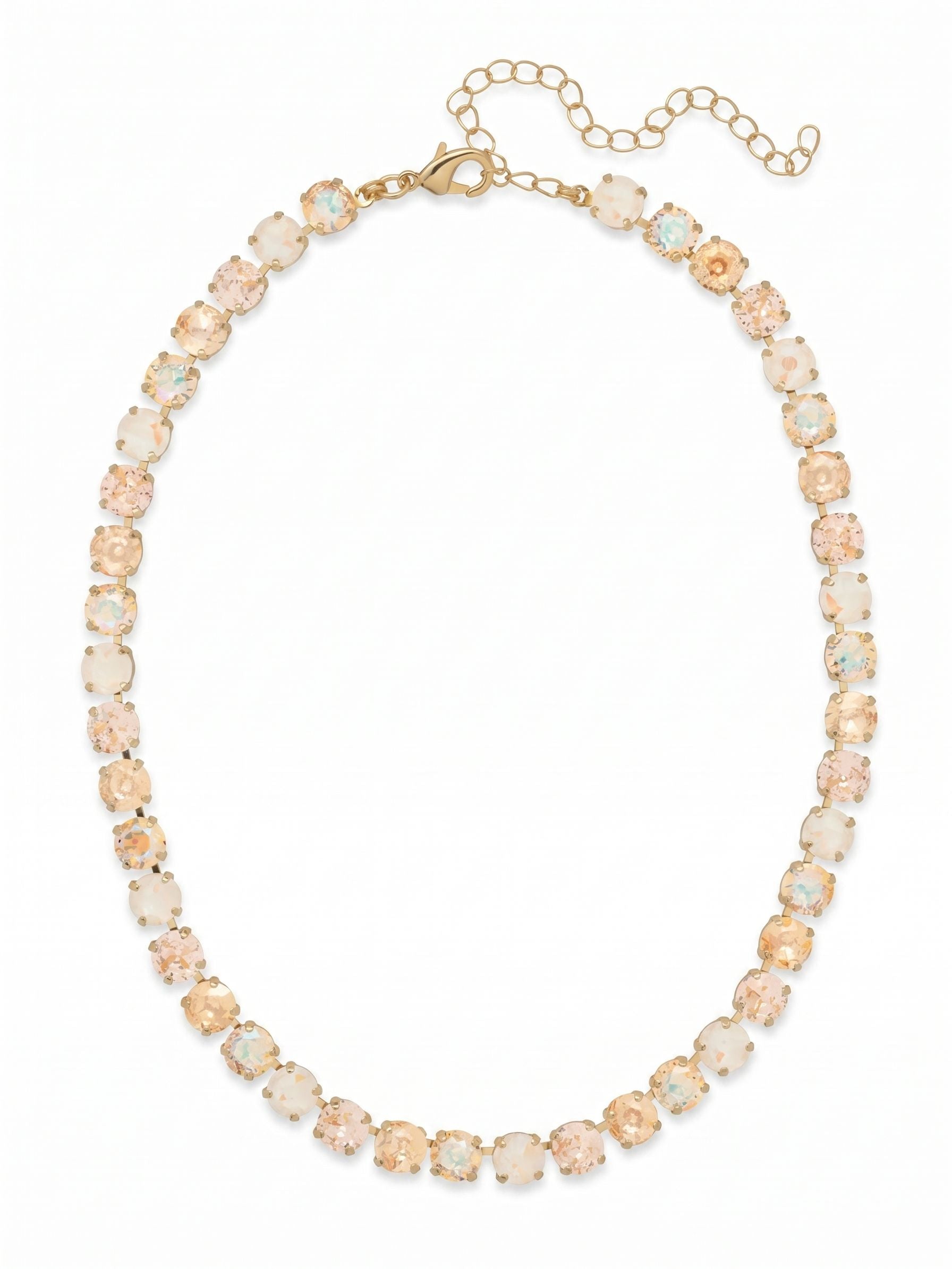 Matilda Tennis Necklace - NFJ4BGGGO - <p>A continuous ribbon of warm light encircles the collarbone. The Matilda necklace blends the soft flush of vintage rose with golden shadow and ultra white crystals, creating a fluid wash of color that shifts naturally as you move. Built on a flexible, crystal-set chain, it drapes with a comfortable weight and catches the room's light from every angle. The included extension chain lets you easily adjust the length, ensuring it falls precisely where you want it whether layered under an open collar or worn close to the throat.</p><ul>
<li>Alternating warm-toned and iridescent round crystals create a fluid color gradient</li>
<li>Flexible continuous channel chain design ensures fluid movement</li>
<li>Lobster claw clasp</li>
<li>4-inch adjustable extension chain</li>
<li>Protective e-coat finish for lasting wear</li>
<li>Includes signature organza pouch for gifting and travel</li>
</ul>