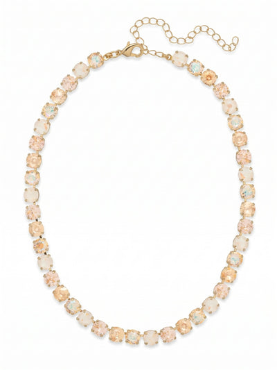 Matilda Tennis Necklace - NFJ4BGGGO - <p>A continuous ribbon of warm light encircles the collarbone. The Matilda necklace blends the soft flush of vintage rose with golden shadow and ultra white crystals, creating a fluid wash of color that shifts naturally as you move. Built on a flexible, crystal-set chain, it drapes with a comfortable weight and catches the room's light from every angle. The included extension chain lets you easily adjust the length, ensuring it falls precisely where you want it whether layered under an open collar or worn close to the throat.</p><ul>
<li>Alternating warm-toned and iridescent round crystals create a fluid color gradient</li>
<li>Flexible continuous channel chain design ensures fluid movement</li>
<li>Lobster claw clasp</li>
<li>4-inch adjustable extension chain</li>
<li>Protective e-coat finish for lasting wear</li>
<li>Includes signature organza pouch for gifting and travel</li>
</ul>