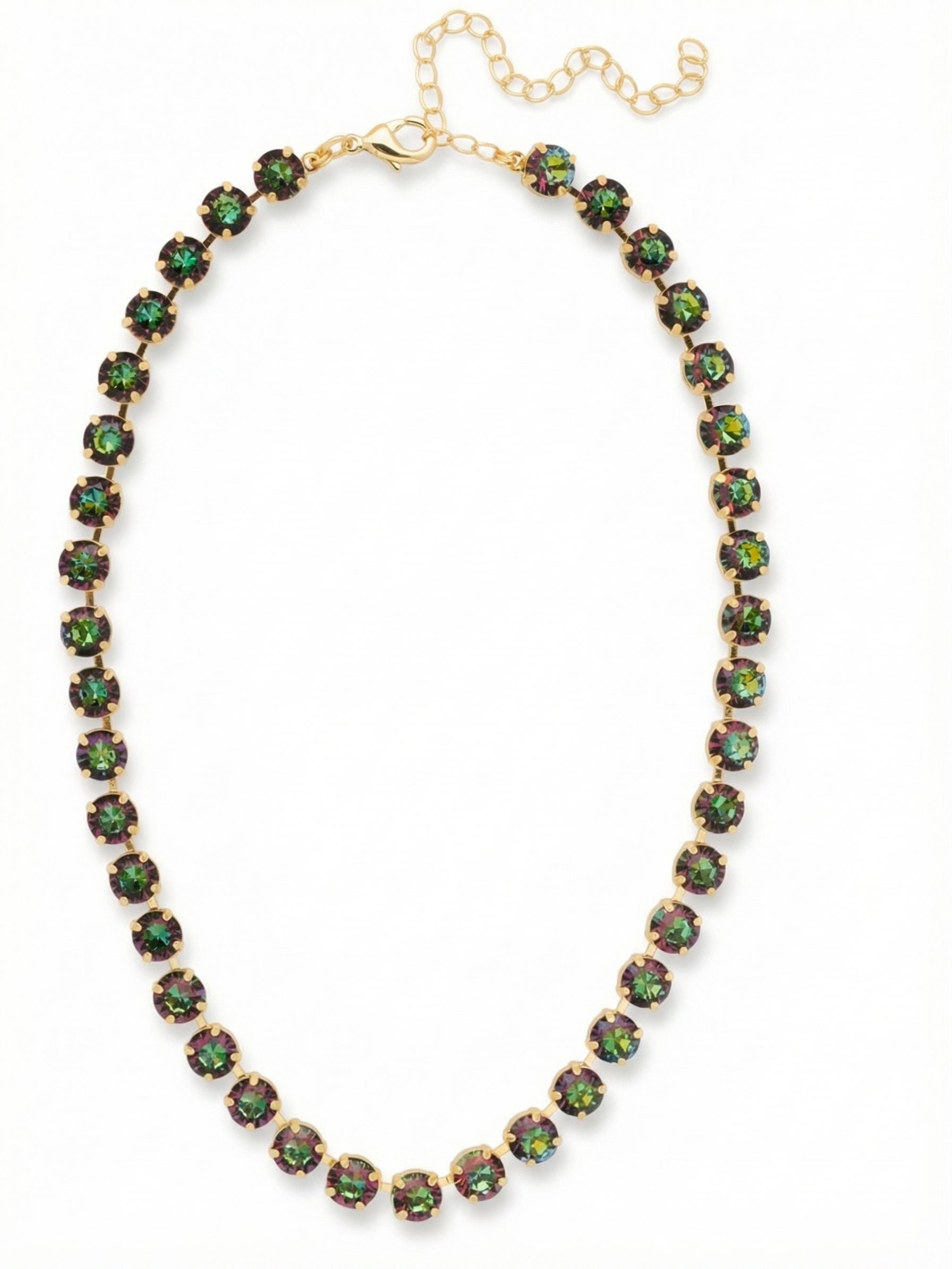Matilda Tennis Necklace - NFJ4BGVO - <p>A continuous line of shifting color anchors the neckline in a fluid sequence of round-cut crystals. These stones catch the light from every angle, revealing deep greens and rich purples as you move. Built on a traditional crystal-set chain, the necklace naturally follows the contour of your collarbone with a satisfying weight. The built-in extension chain offers styling versatility, allowing you to wear it close to the throat or relaxed over a favorite knit. It is a substantial, highly wearable piece that easily adapts to your daily routine.</p><ul>
<li>Continuous sequence of substantial round-cut crystals</li>
<li>Fluid channel chain allows the piece to contour naturally to the neckline</li>
<li>Lobster claw clasp</li>
<li>4-inch adjustable extension chain</li>
<li>Protective e-coat finish for lasting wear</li>
<li>Includes signature organza pouch for gifting and travel</li>
</ul>
