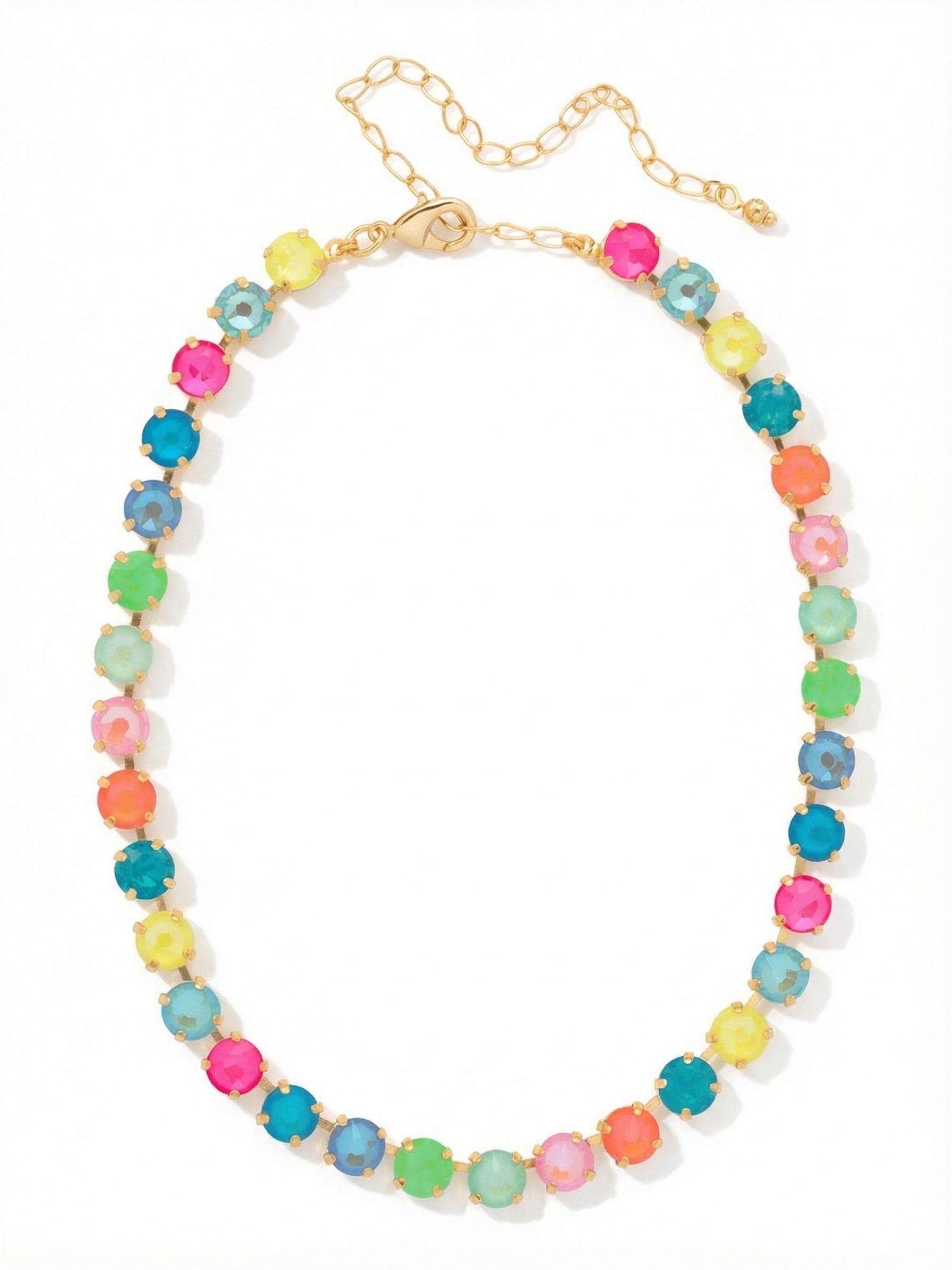 Matilda Choker Necklace - NFJ80BGCCA - <p>A continuous line of saturated color anchors the collarbone. Built on a flexible crystal-set chain, this choker drapes naturally without feeling stiff. Thirty-three round-cut crystals alternate in a bright palette of electric pink, mint, Caribbean blue, and warm yellow, held by a bright gold-tone setting that amplifies the vivid hues. An extension chain lets you tailor the fit exactly to your neckline. Worn alone with an open collar or layered into a heavier gold stack, it adds a vibrant, distinct focal point to your daily rotation.</p><ul>
<li>Continuous line of saturated multicolored round-cut crystals</li>
<li>Flexible channel construction follows the natural curve of the neck</li>
<li>Lobster claw clasp</li>
<li>4-inch adjustable extension chain</li>
<li>Protective e-coat finish for lasting wear</li>
<li>Includes signature organza pouch for gifting and travel</li>
</ul>