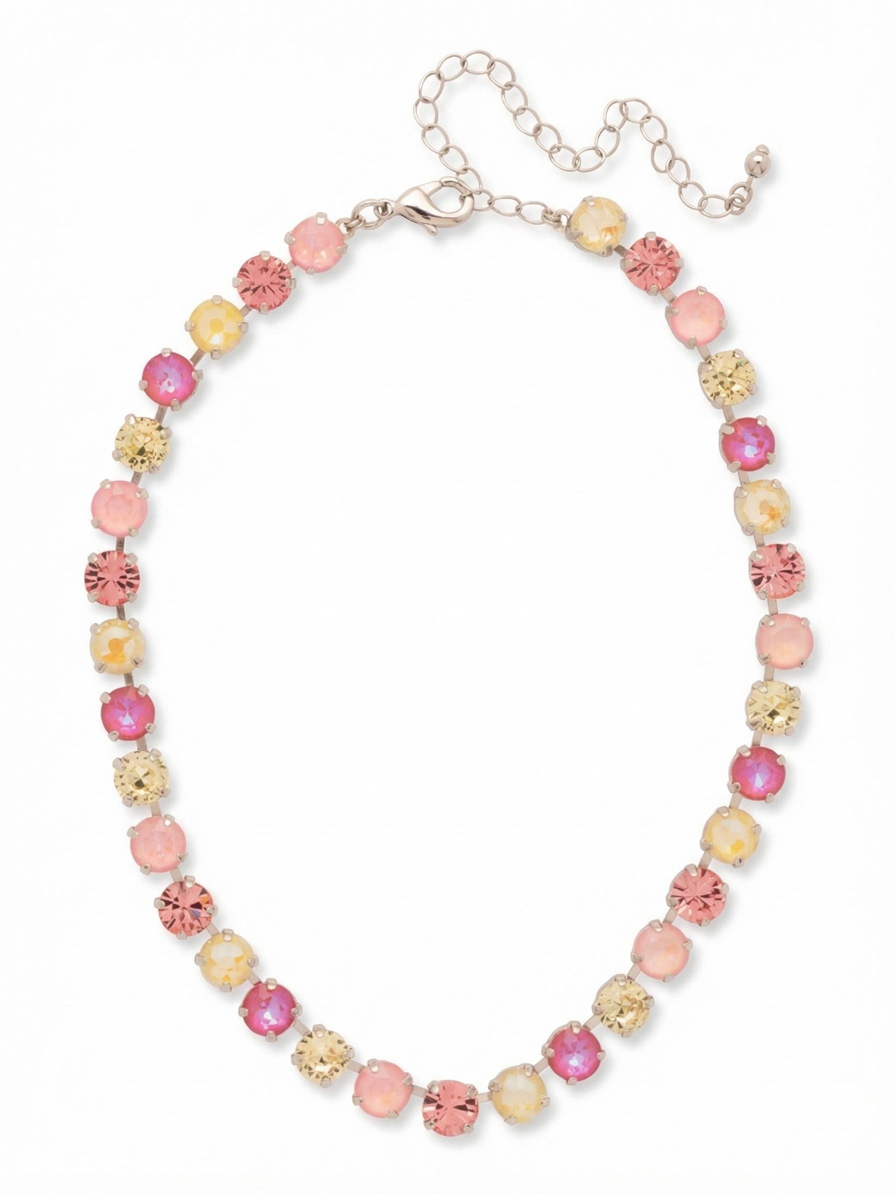 Matilda Choker Necklace - NFJ80PDPPN - <p>An unbroken line of thirty-three round-cut crystals brings a warm rhythm of pink and pale yellow to the base of the neck. Constructed on an articulated kette chain, this choker fluidly traces the collarbone and moves with you instead of shifting out of place. The alternating shades of light rose, jonquil, and petal pink offer substantial presence that still feels entirely grounded for daily wear. The built-in extension chain allows you to adjust the drape exactly where you prefer it to rest.</p><ul>
<li>Articulated crystal-set channel chain follows the natural curve of the neck</li>
<li>Unbroken rhythm of alternating warm pink and soft yellow crystals</li>
<li>Lobster claw clasp</li>
<li>4-inch adjustable extension chain</li>
<li>Protective e-coat finish for lasting wear</li>
<li>Includes signature organza pouch for gifting and travel</li>
</ul>