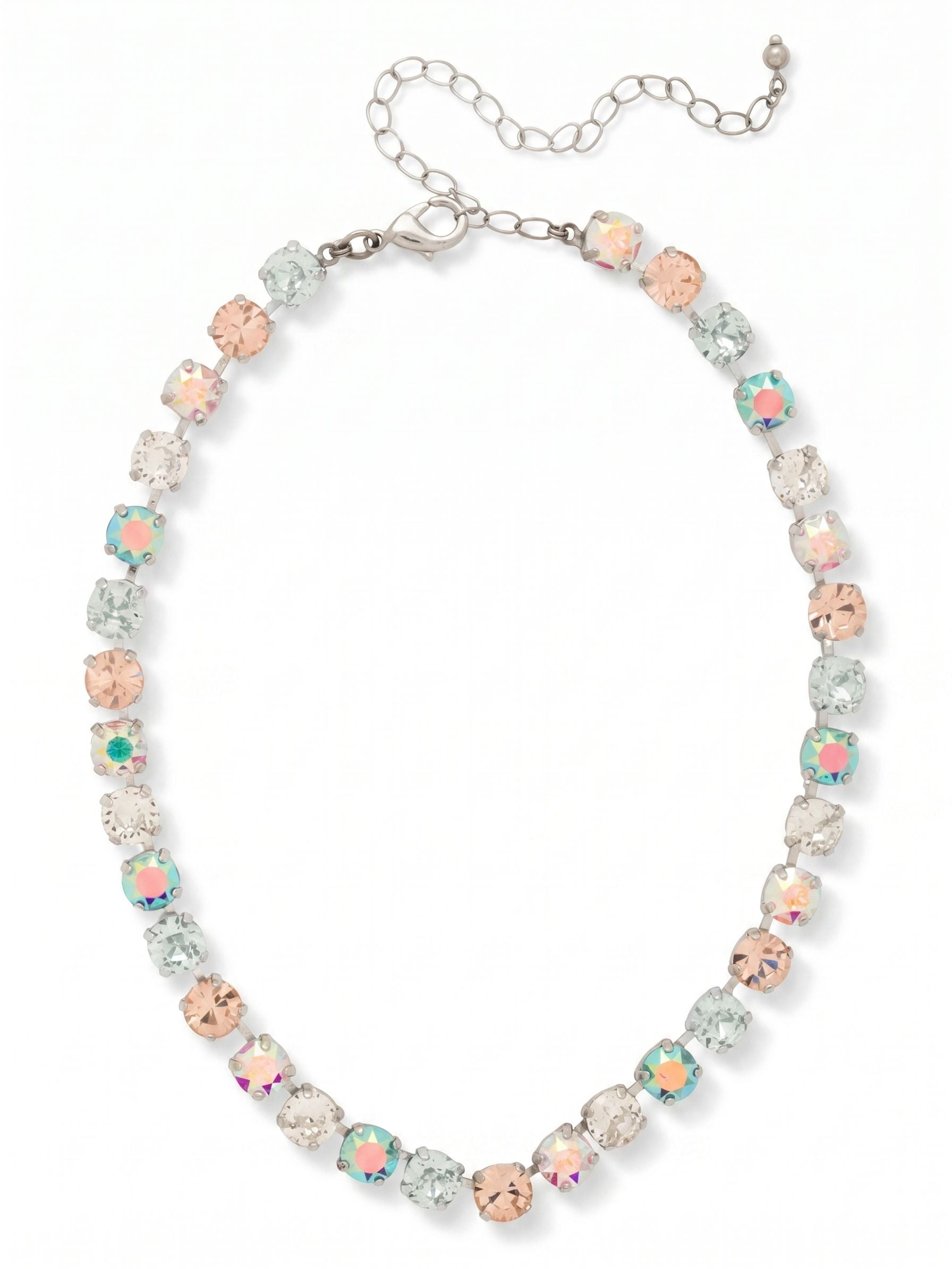 Matilda Choker Necklace - NFJ80PDRQ - <p>A continuous line of round cut crystals rests closely along the collarbone, anchored by a traditional kette chain construction that fluidly follows your movements. The color palette shifts softly in the light, blending clear crystals with gentle tones of pale rose and light azore. Stones treated with an aurora borealis finish catch subtle prismatic reflections as the necklace turns. An included extension chain allows you to adjust the drop, making it easy to position this piece exactly where it feels right over an open neckline or layered with longer chains.</p><ul>
<li>Alternating pastel and iridescent round cut crystals</li>
<li>Traditional kette chain construction for a fluid drape</li>
<li>Lobster claw clasp</li>
<li>4-inch adjustable extension chain</li>
<li>Protective e-coat finish for lasting wear</li>
<li>Includes signature organza pouch for gifting and travel</li>
</ul>