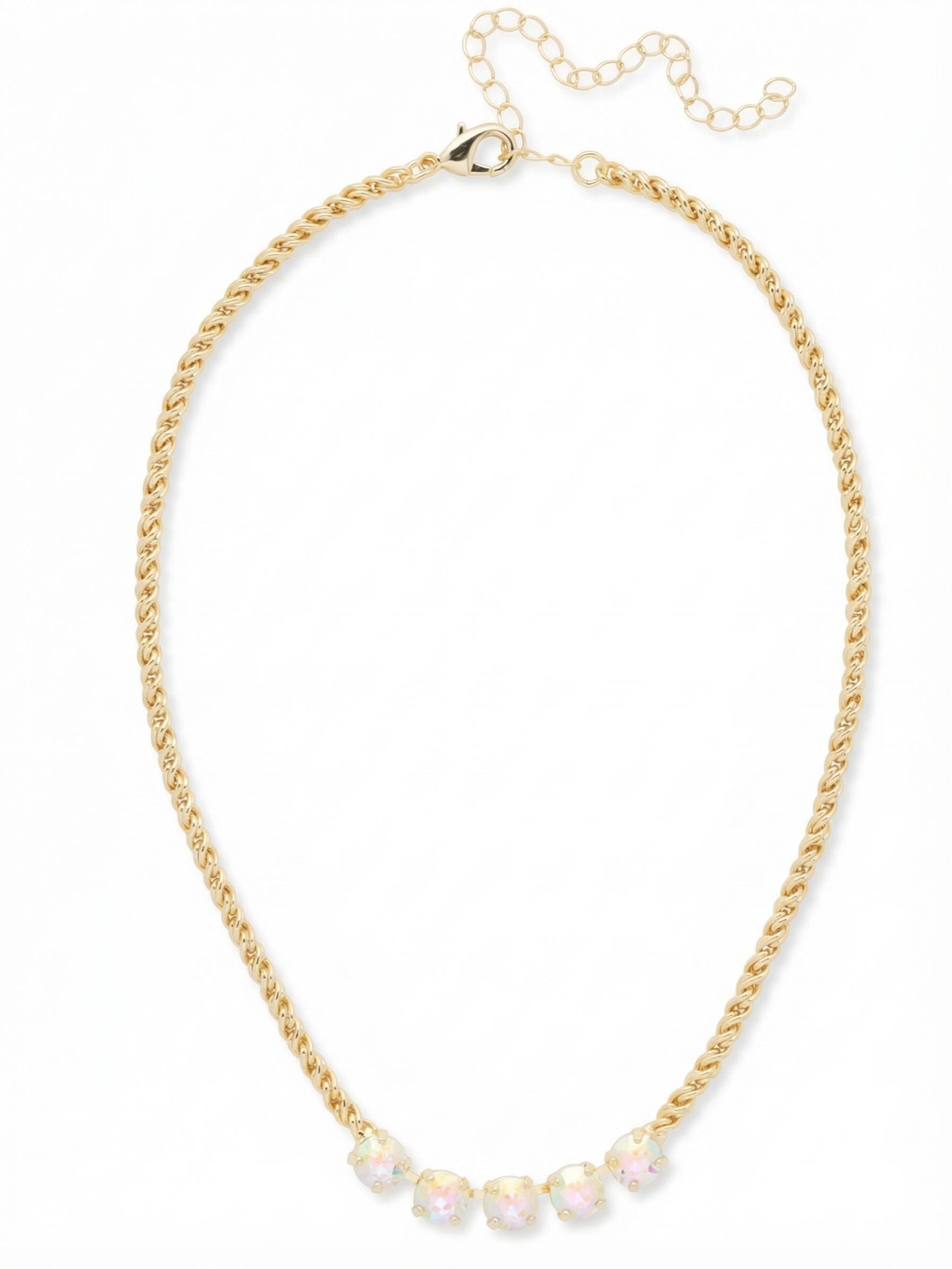 Shannon Tennis Necklace - NFL1BGCAB - <p>A thick rope chain provides a warm, textured foundation that settles comfortably along the collarbone. At the center, a focused row of five round crystals catches the light, offering a burst of iridescent color against the woven metal. The contrast between the substantial chain and the bright, shifting facets creates a grounded focal point. An integrated extension chain allows you to adjust the drape, adapting the piece to sit exactly where you want it.</p><ul>
<li>Thick woven rope chain provides a substantial textured base</li>
<li>Five round crystals are grouped at the center for a concentrated focal point</li>
<li>Lobster claw clasp</li>
<li>4-inch adjustable extension chain</li>
<li>Protective e-coat finish for lasting wear</li>
<li>Includes signature organza pouch for gifting and travel</li>
</ul>