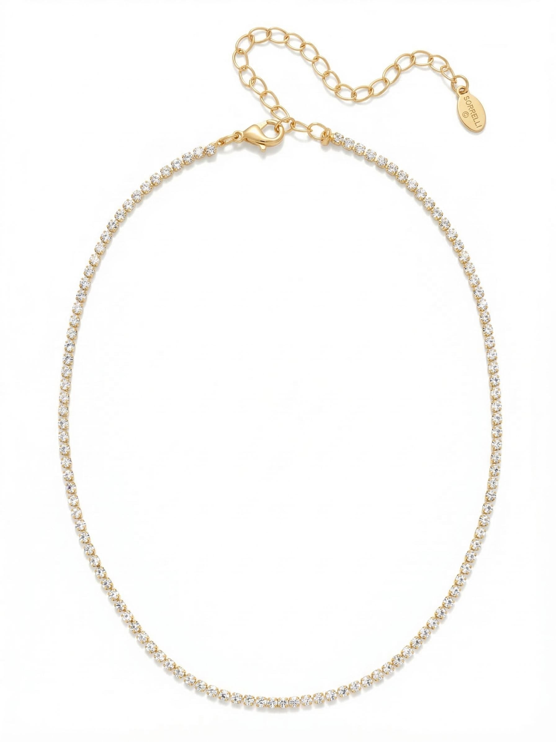 Mini Marnie Choker Tennis Necklace - NFL22BGCRY - <p>A fine thread of crystal that brings a quiet polish to your daily rotation. The delicate rhinestone chain sits close to the collarbone, creating a continuous line of light that feels almost weightless. A four-inch extension chain lets you adjust the drape to suit different necklines, making it a natural layering foundation or a subtle solo accent. It is a minimalist staple that catches the light with your every movement.</p><ul>
<li>Ultra-fine rhinestone chain creates a continuous line of light</li>
<li>Minimalist scale designed for seamless daily layering</li>
<li>Lobster claw clasp</li>
<li>4-inch adjustable extension chain</li>
<li>Protective e-coat finish for lasting wear</li>
<li>Includes signature organza pouch for gifting and travel</li>
</ul>