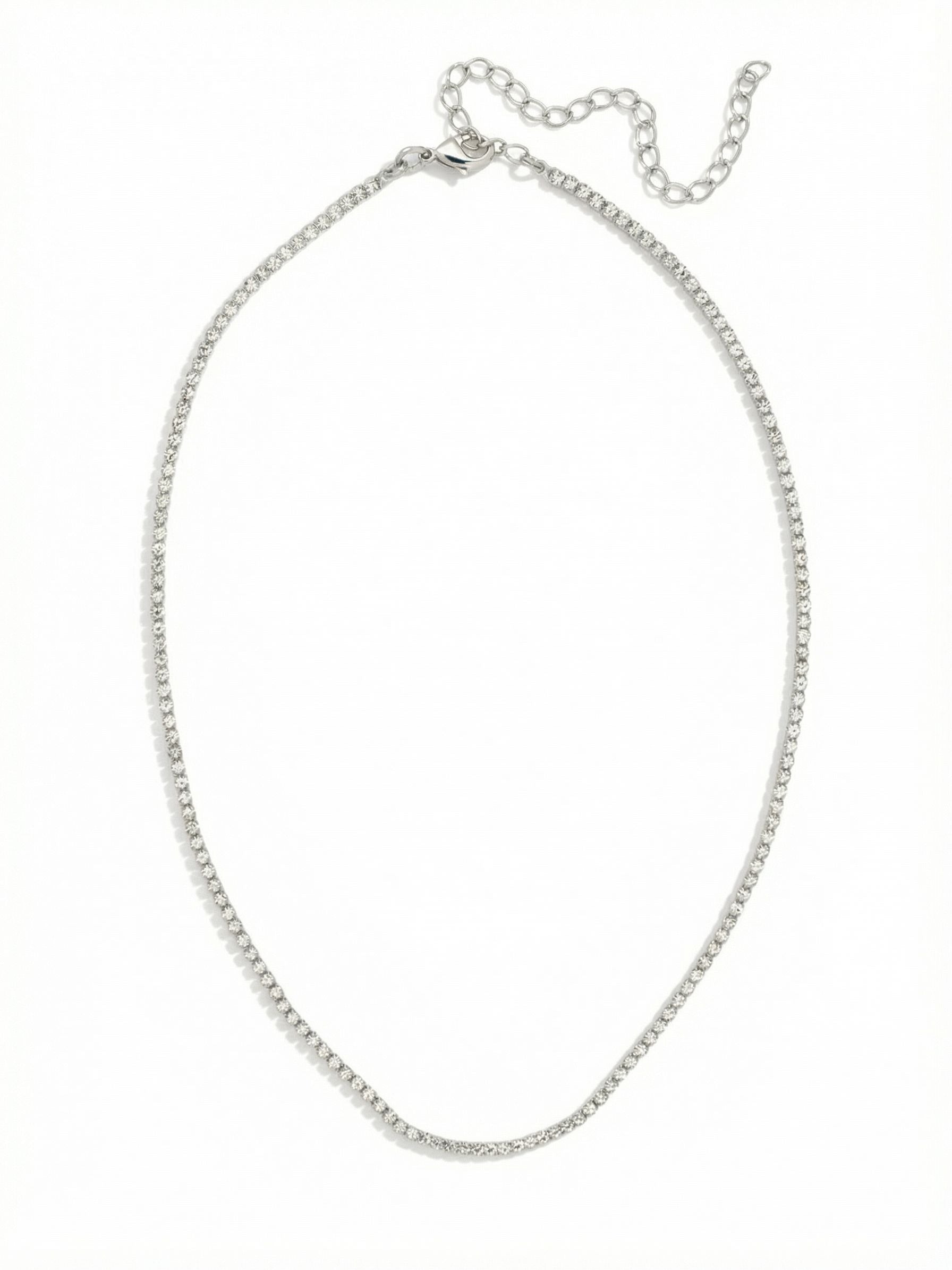 Mini Marnie Tennis Necklace - NFL2PDCRY - <p>The Mini Marnie Tennie Necklace features a dainty rhinestone chain, adjustable and secured with a lobster claw clasp. (16-20 inches)</p>