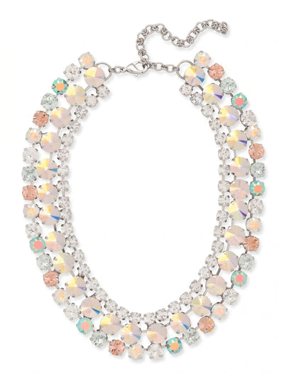 Sloane Layered Statement Necklace - NFL60PDRQ - <p>The Sloane Layered Statement Necklace brings a substantial, satisfying weight and immediate brilliance to your neckline. Constructed with a crystal-set kette chain, it drapes fluidly across the collarbones and moves naturally with you. Over a hundred round-cut stones in shades of pale rose, soft blue, and iridescent aurora borealis create a shifting wash of color. The palladium finish grounds the pastel palette with a cool, polished edge. An included extension chain allows you to easily adjust the drop to complement your chosen neckline.</p><ul>
<li>Layered kette chain construction creates a fluid, flexible drape across the collarbones</li>
<li>Mixed sizes of round-cut pastel and iridescent crystals offer a shifting play of light</li>
<li>Lobster claw clasp</li>
<li>4-inch adjustable extension chain</li>
<li>Protective e-coat finish for lasting wear</li>
<li>Includes signature organza pouch for gifting and travel</li>
</ul>