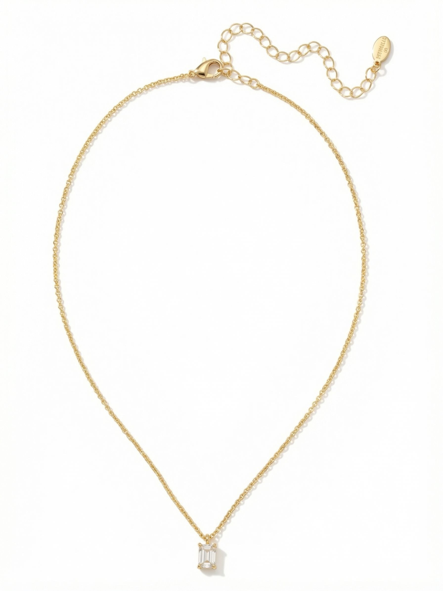 Petite Emerald Pendant Necklace - NFM13BGCRY - <p>A single emerald-cut crystal brings quiet structure to this minimal pendant. Suspended from a fine cable chain, the clear step-cut facets catch the light cleanly as you move through your day. It rests closely at the collarbone, offering a subtle focal point that feels intentional rather than loud. The built-in extension chain lets you adapt the drop to suit different necklines, making it a reliable foundation for layering or a refined standalone piece for everyday wear.</p><ul>
<li>Crisp emerald-cut crystal offers clean geometric lines</li>
<li>Fine cable chain creates a delicate floating effect</li>
<li>Lobster claw clasp</li>
<li>4-inch adjustable extension chain</li>
<li>Protective e-coat finish for lasting wear</li>
<li>Includes signature organza pouch for gifting and travel</li>
</ul>