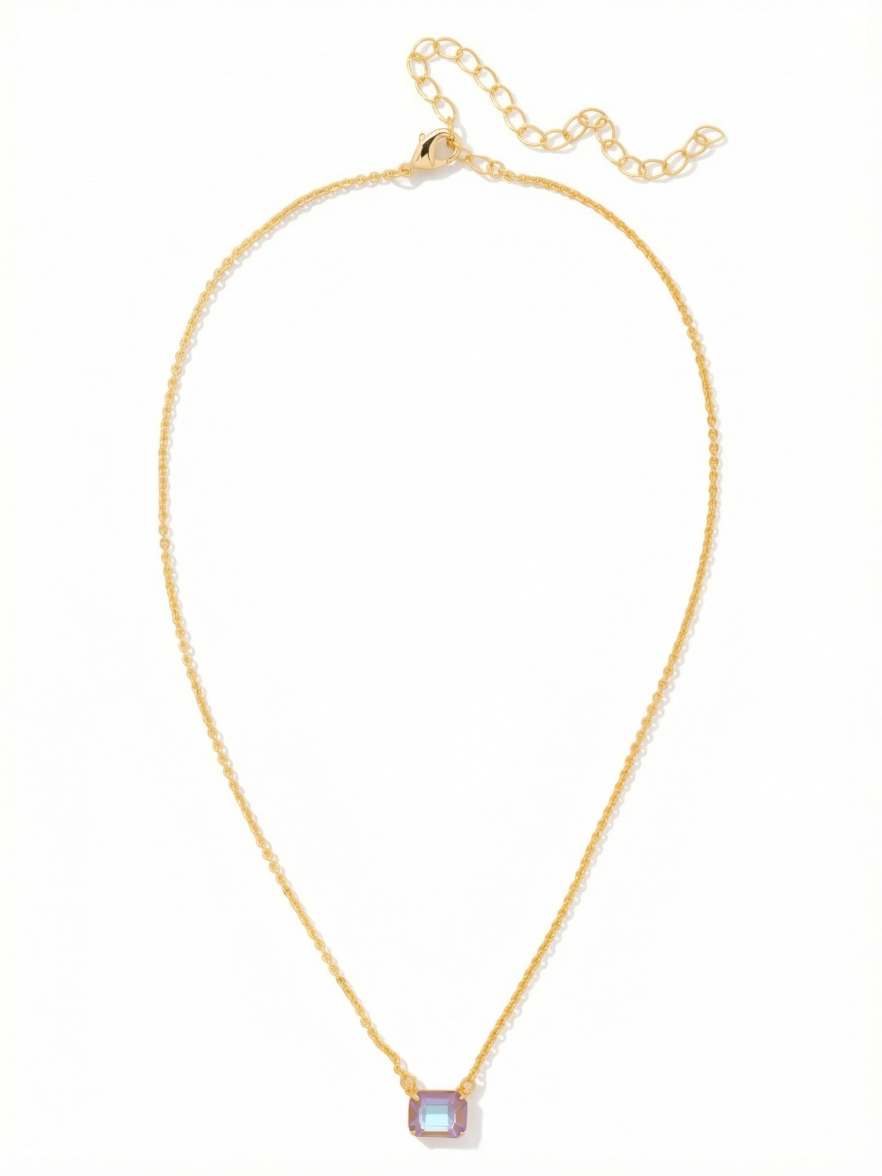 Octavia Single Crystal Pendant Necklace - NFM30BGCPD - <p>A solitary emerald-cut crystal draws the eye with its clean, linear facets. Suspended on a fine cable chain, the Octavia pendant is designed to rest comfortably near the collarbone. The stone catches the light naturally as you move, offering a subtle shift of color and depth. The built-in extension chain allows you to adjust the drop, so it places perfectly whether framed by an open collar or layered closely with longer chains for your daily rotation.</p><ul>
<li>Emerald-cut center stone provides clean architectural lines</li>
<li>Fine cable chain creates a delicate floating effect</li>
<li>Lobster claw clasp</li>
<li>4-inch adjustable extension chain</li>
<li>Protective e-coat finish for lasting wear</li>
<li>Includes signature organza pouch for gifting and travel</li>
</ul>