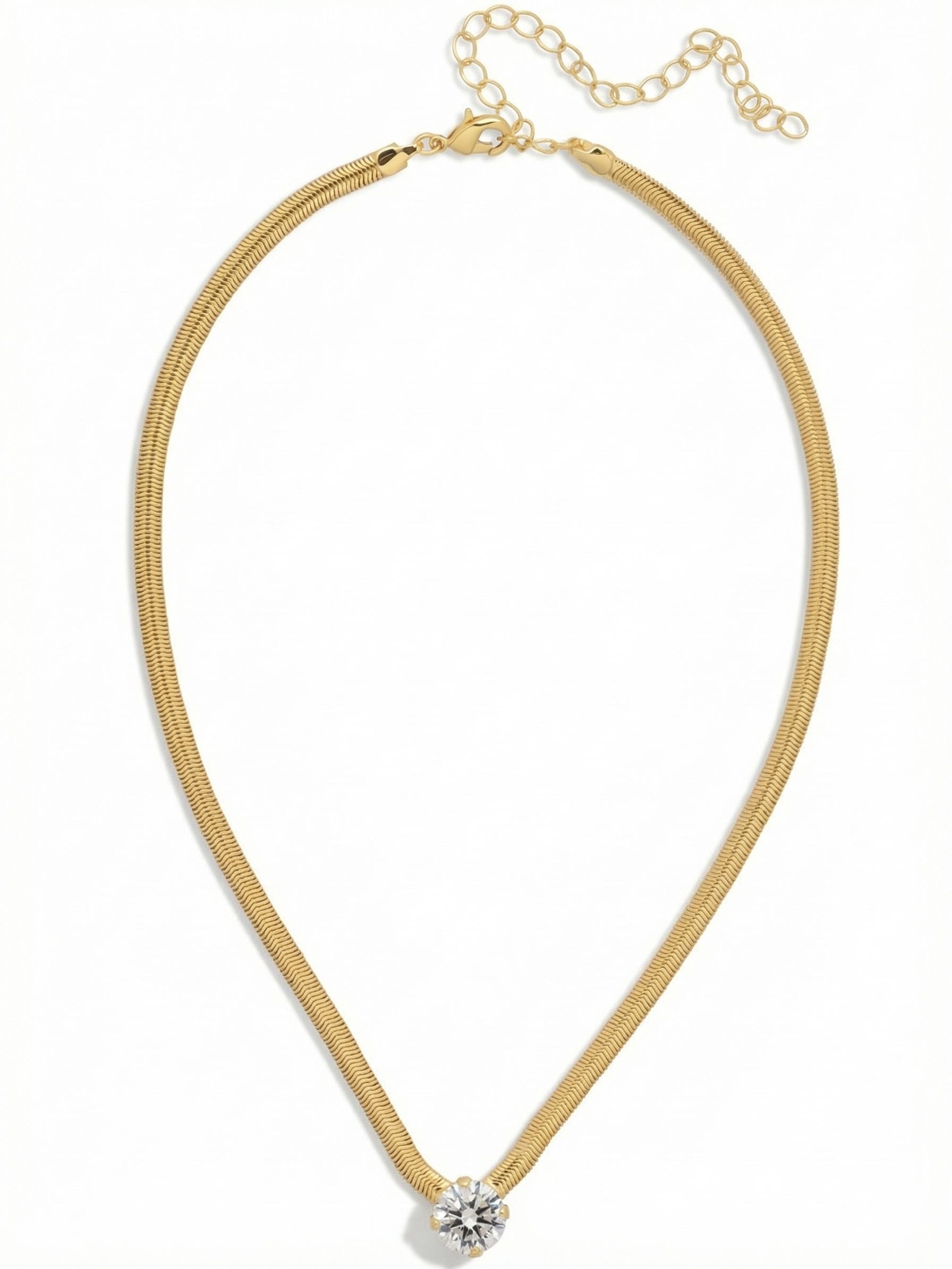Rowan Pendant Necklace - NFP17BGCRY - <p>A single round-cut clear crystal acts as the anchor point for a fluid, continuous snake chain. The smoothly woven links catch the light naturally as you move, drawing the eye down to the center stone. Because of the chain's inherent flexibility, the necklace conforms comfortably to the collarbone. You can easily alter the drop using the extension chain, allowing the pendant to rest perfectly within an open collar or over a simple neckline.</p><ul>
<li>Fluid snake chain offers a sleek and continuous metallic texture</li>
<li>A single prominent round-cut clear crystal creates a minimalist focal point</li>
<li>Lobster claw clasp</li>
<li>4-inch adjustable extension chain</li>
<li>Protective e-coat finish for lasting wear</li>
<li>Includes signature organza pouch for gifting and travel</li>
</ul>