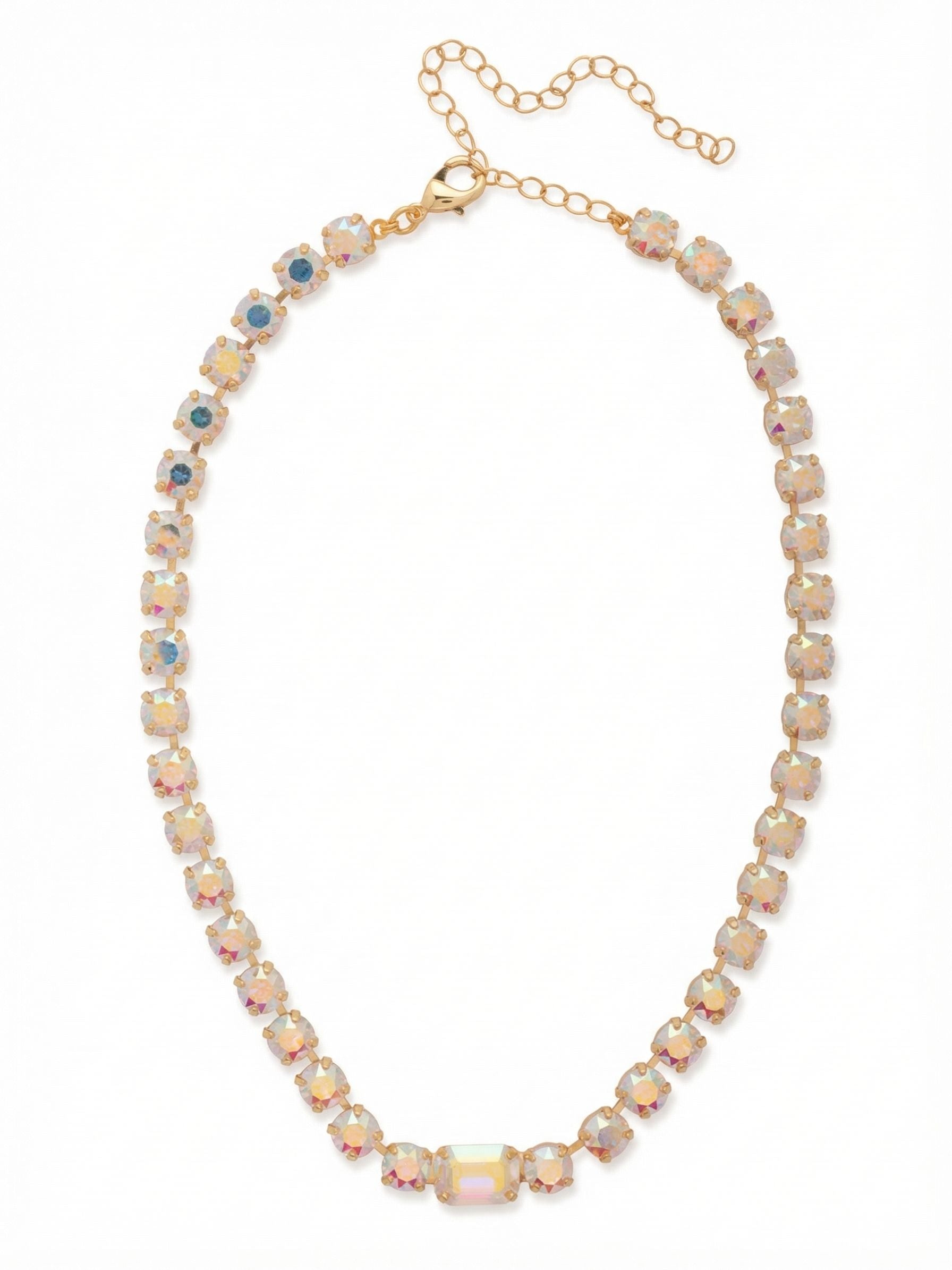 Anya Tennis Necklace - NFS1BGCAB - <p>Add a touch of sophistication with the Anya Tennis Necklace, showcasing a beautiful arrangement of round-cut crystals and a striking emerald-cut centerpiece. This adjustable necklace is secured with a lobster claw clasp, ensuring a comfortable and stylish fit. (16-20 inches) From Sorrelli's Crystal Aurora Borealis collection in our Bright Gold-tone finish.</p>