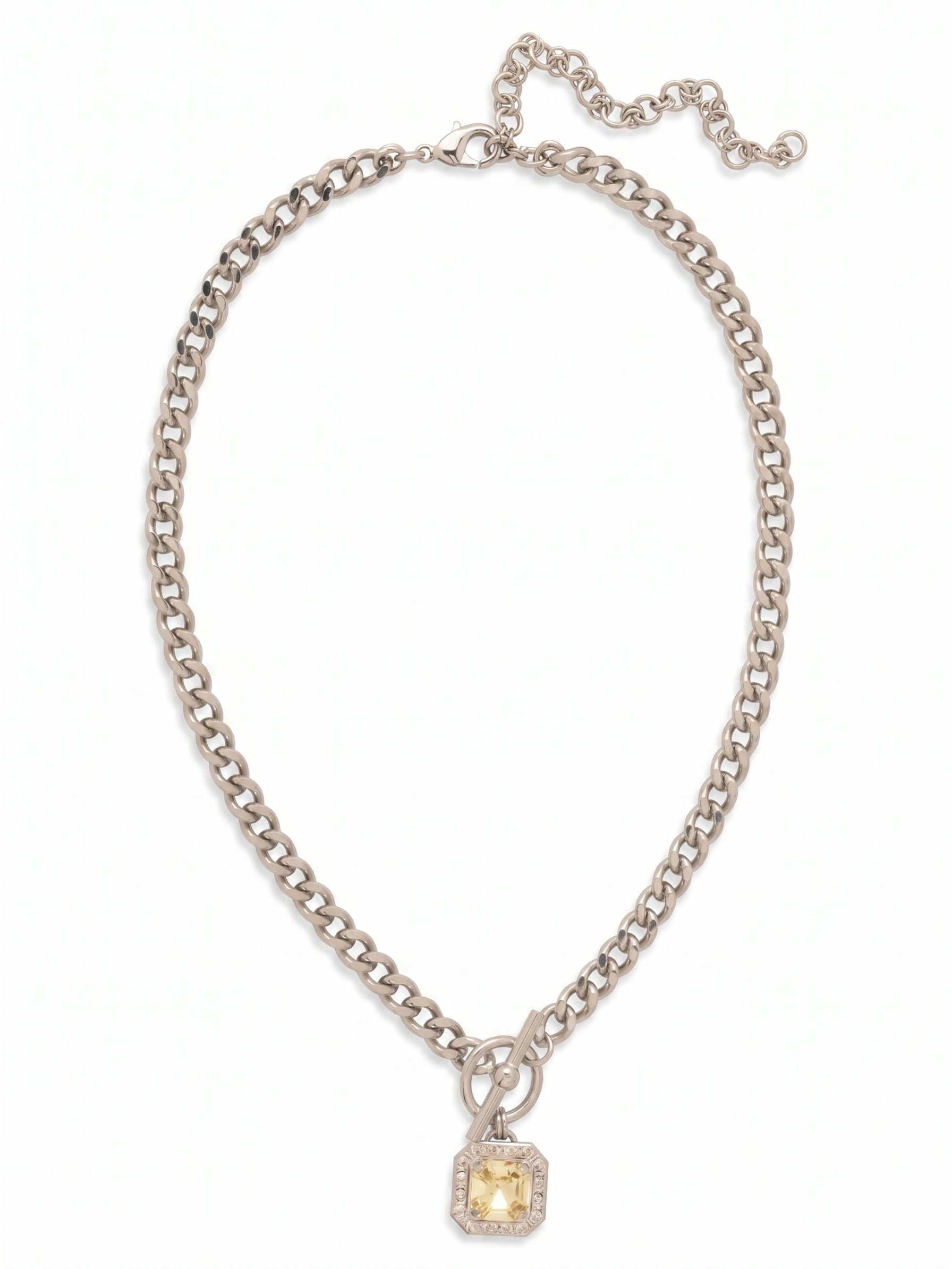 Autumn Pendant Necklace - NFS5PDLZ - <p>A substantial cable chain grounds this pendant necklace, balancing soft color with heavier hardware. The focal point is a square-cut jonquil crystal suspended from a toggle-style ring detail, shifting to catch light with your movement. Designed to rest comfortably near the collarbone, the satisfying weight of the chain provides a secure, settled feel. An extension chain at the back allows you to adjust the drop, placing the crystal exactly where you want it across different necklines.</p><ul>
<li>Substantial cable chain with a decorative toggle-style front drop</li>
<li>Square-cut crystal set in a delicate halo frame</li>
<li>Lobster claw clasp</li>
<li>4-inch adjustable extension chain</li>
<li>Protective e-coat finish for lasting wear</li>
<li>Includes signature organza pouch for gifting and travel</li>
</ul>