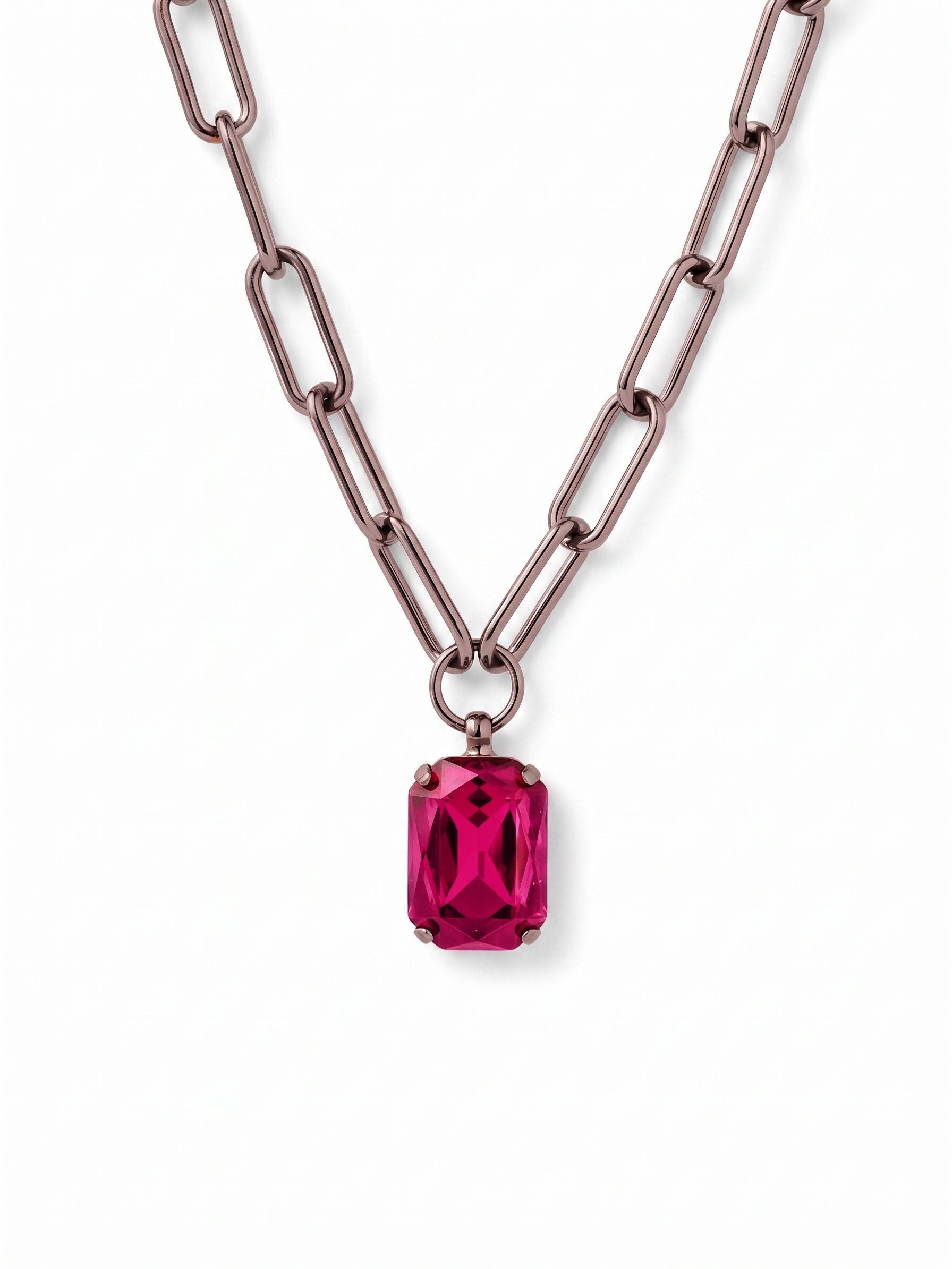 Brynn Paperclip Pendant Necklace - NFS78GMFU - <p>A vivid emerald-cut fuchsia crystal anchors this modern pendant. The elongated links of the paperclip chain give the piece an airy feel that falls naturally at the collarbone. Suspended from a simple ring, the faceted crystal catches the light with your everyday movement. Complete with an extension chain to fine-tune the length, it layers effortlessly with fine strands or stands out as a solitary pop of color over a plain neckline.</p><ul>
<li>Modern paperclip chain with elongated open links</li>
<li>Bold emerald-cut central fuchsia crystal</li>
<li>Lobster claw clasp</li>
<li>4-inch adjustable extension chain</li>
<li>Includes organza pouch for gifting and travel</li>
</ul>