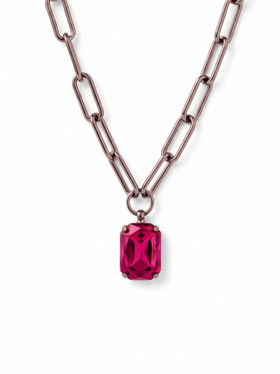 Brynn Paperclip Pendant Necklace - NFS78GMFU - <p>A vivid emerald-cut fuchsia crystal anchors this modern pendant. The elongated links of the paperclip chain give the piece an airy feel that falls naturally at the collarbone. Suspended from a simple ring, the faceted crystal catches the light with your everyday movement. Complete with an extension chain to fine-tune the length, it layers effortlessly with fine strands or stands out as a solitary pop of color over a plain neckline.</p><ul>
<li>Modern paperclip chain with elongated open links</li>
<li>Bold emerald-cut central fuchsia crystal</li>
<li>Lobster claw clasp</li>
<li>4-inch adjustable extension chain</li>
<li>Includes organza pouch for gifting and travel</li>
</ul>
