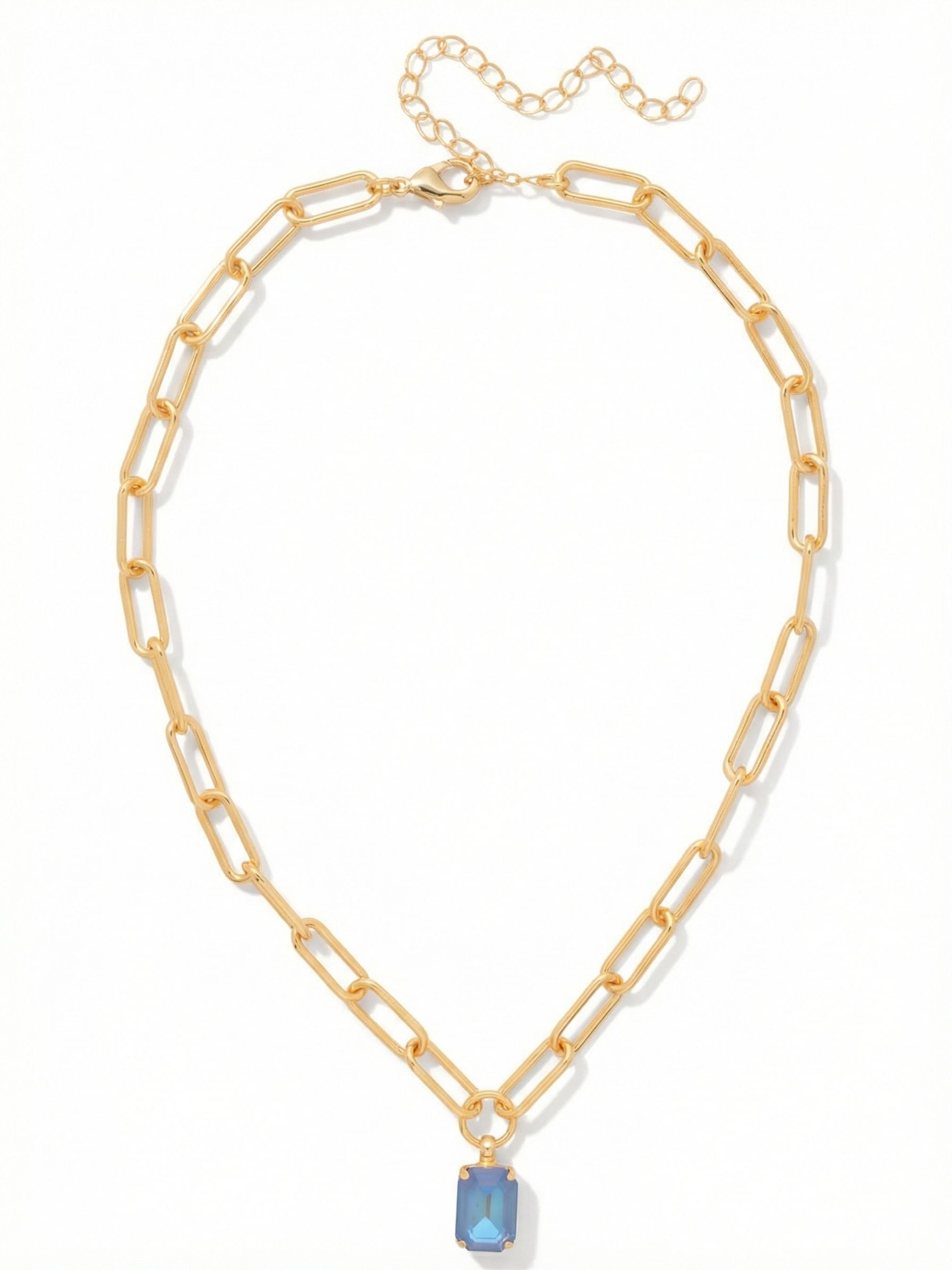 Nia Pendant Necklace - NFS7BGOCD - <p>An emerald-cut crystal acts as the focal point, suspended from an airy paperclip chain. The clean, linear facets of the stone offer a structured contrast to the smooth, elongated links resting near the collarbone. With its open metalwork, the chain brings a modern texture without feeling heavy on the neck. An extension chain allows you to adjust the drop, making it an easy starting point for building a layered look.</p><ul>
<li>Single emerald-cut crystal with clean step-cut facets</li>
<li>Open paperclip chain provides a lightweight modern profile</li>
<li>Lobster claw clasp</li>
<li>4-inch adjustable extension chain</li>
<li>Protective e-coat finish for lasting wear</li>
<li>Includes signature organza pouch for gifting and travel</li>
</ul>