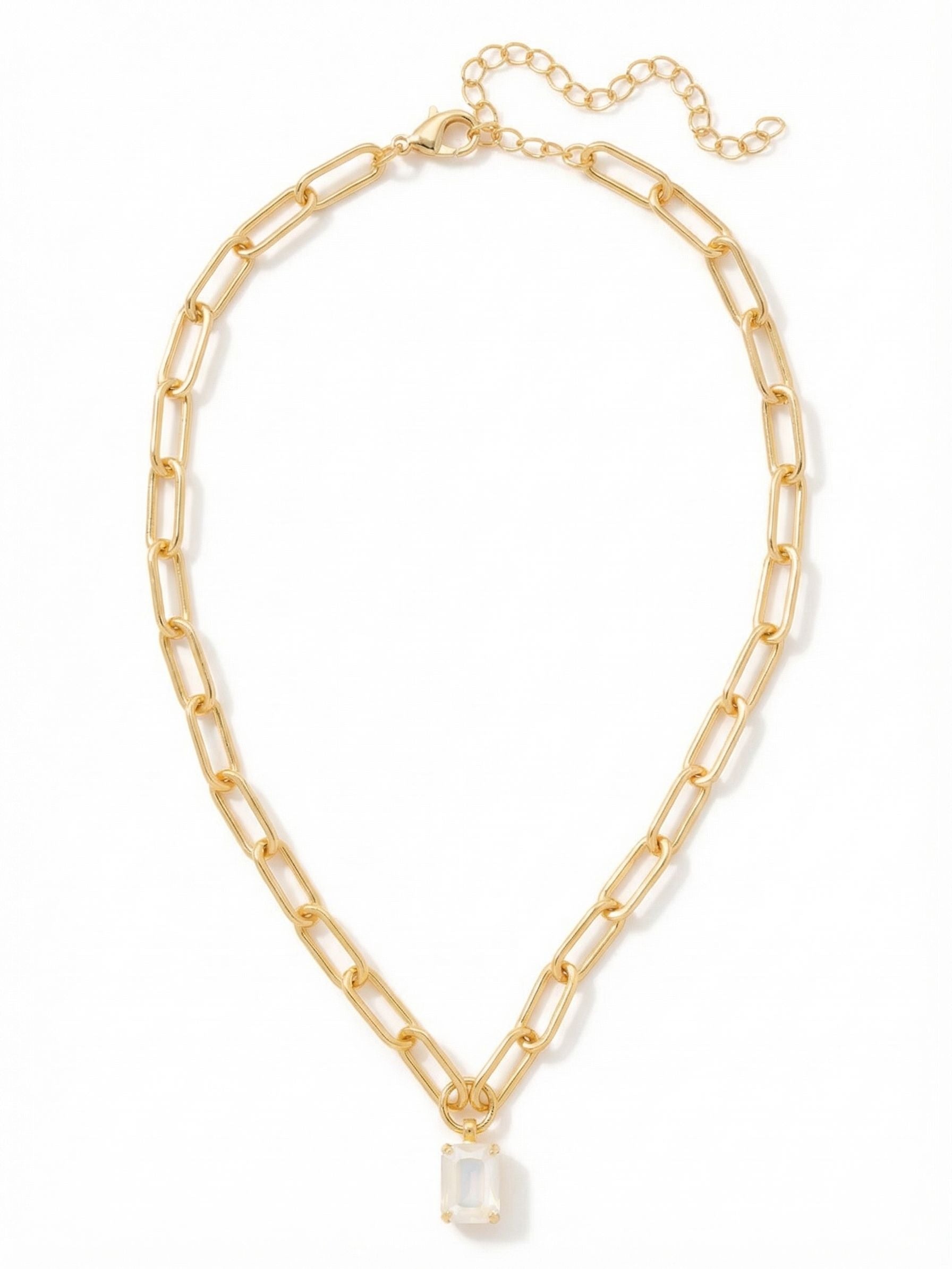 Nia Pendant Necklace - NFS7BGUWAB - <p>A single emerald-cut crystal anchors this modern pendant, suspended from a sturdy paperclip chain. The elongated gold-tone links offer a structural contrast to the iridescent flash of the stone, creating a piece that feels both grounded and light-catching. Designed to drape cleanly along the collarbone, the chain holds its shape through the day. An adjustable clasp lets you raise or lower the pendant to sit precisely within your neckline, making it a reliable foundation for daily wear.</p><ul>
<li>Clean geometric contrast between an emerald-cut center stone and elongated oval links</li>
<li>Structural paperclip chain that holds its shape gracefully on the collarbone</li>
<li>Lobster claw clasp</li>
<li>4-inch adjustable extension chain</li>
<li>Protective e-coat finish for lasting wear</li>
<li>Includes signature organza pouch for gifting and travel</li>
</ul>
