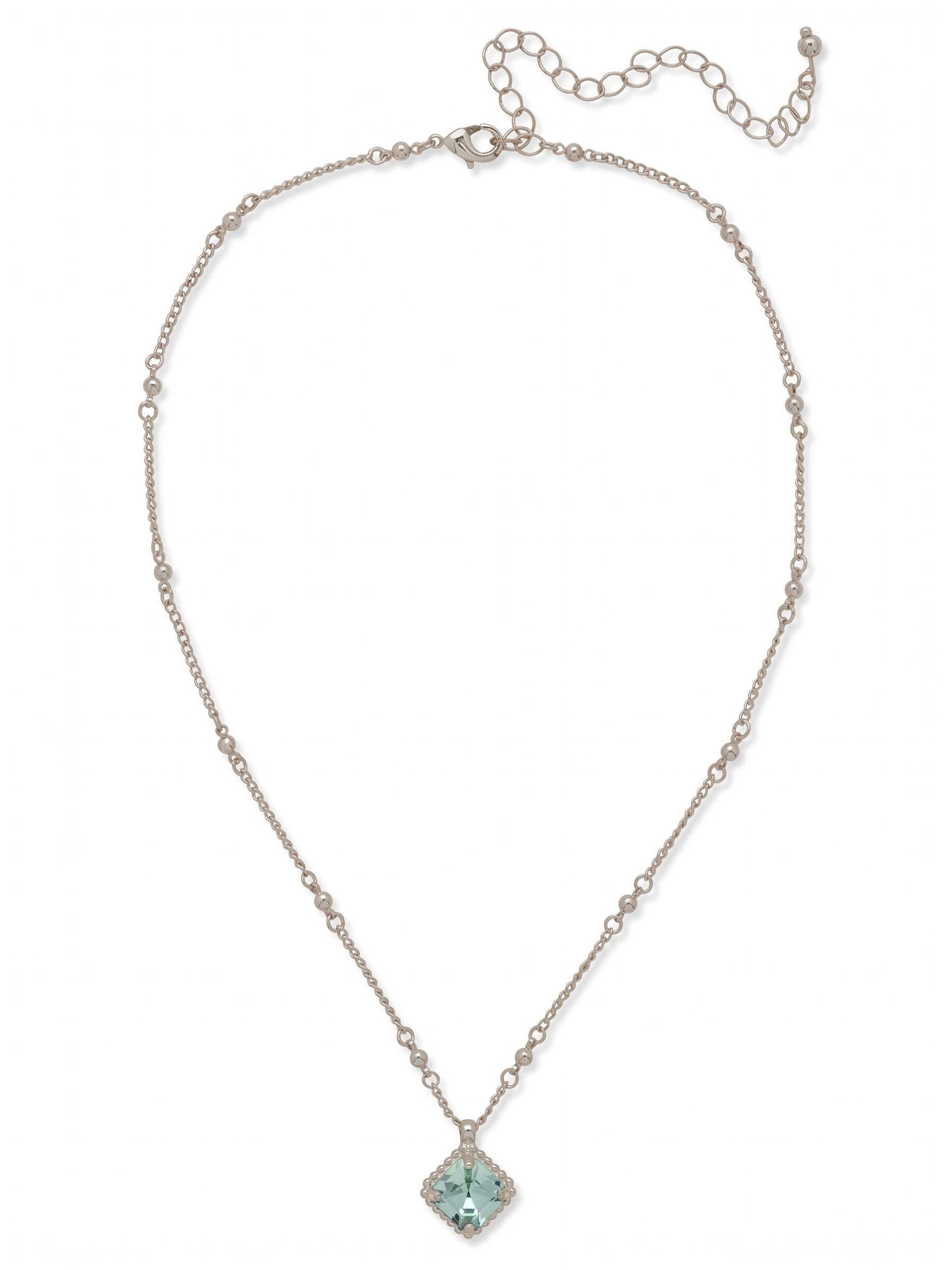 Izzy Decorated Pendant Necklace - NFY2PDAQU - <p>A single pale blue crystal rests at the collarbone. Set on a diagonal, the square-cut aquamarine stone is anchored by a finely textured metal bezel. The necklace chain adds subtle visual interest to the neckline, interspersing delicate cable links with small metallic beads. It serves as a quiet anchor for your daily jewelry uniform. The piece layers seamlessly with longer strands but easily holds its own over an open collar, while the adjustable closure ensures an exact fit.</p><ul>
<li>Delicate cable chain punctuated by small metallic beads</li>
<li>Square-cut center stone set on a diagonal within a textured bezel</li>
<li>Lobster claw clasp</li>
<li>4-inch adjustable extension chain</li>
<li>Protective e-coat finish for lasting wear</li>
<li>Includes signature organza pouch for gifting and travel</li>
</ul>