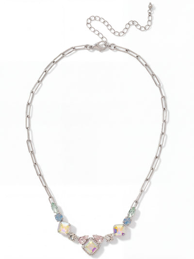 Izzy Tennis Necklace - NFY40PDRQ - <p>Clean paperclip links shift into a softly curved arrangement of mixed-cut crystals sitting right at the collarbone. Iridescent square stones cast a gentle glow alongside muted blue opals and delicate pear shapes. The varied crystal cuts give this piece a balanced weight that rests securely across the chest. It offers a subtle wash of pastel color that frames the face in natural light. An extension chain lets you adjust the drop to complement your specific neckline.</p><ul>
<li>Modern paperclip links transition into a concentrated collar of mixed crystal shapes</li>
<li>Symmetrical progression of square, pear, and marquise cuts framing the center</li>
<li>Lobster claw clasp</li>
<li>4-inch adjustable extension chain</li>
<li>Protective e-coat finish for lasting wear</li>
<li>Includes signature organza pouch for gifting and travel</li>
</ul>