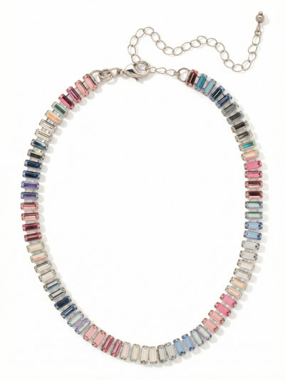 Bianca Choker Tennis Necklace - NFY55PDPBZ - <p>A continuous ribbon of baguette crystals wraps the collarbone in structured color. Moving through soft pinks, deep sapphires, and prismatic aurora borealis stones, the vertical alignment of the cuts catches light in sharp, clean flashes. The classic kette setting keeps the profile sleek and close to the skin. An integrated extension chain lets you adjust the length, allowing the piece to sit as a tight choker or rest slightly lower to frame an open collar.</p><ul>
<li>Continuous collar of vertically aligned baguette crystals</li>
<li>Gradient palette shifting between cool sapphires and warm pinks</li>
<li>Lobster claw clasp</li>
<li>4-inch adjustable extension chain</li>
<li>Protective e-coat finish for lasting wear</li>
<li>Includes signature organza pouch for gifting and travel</li>
</ul>