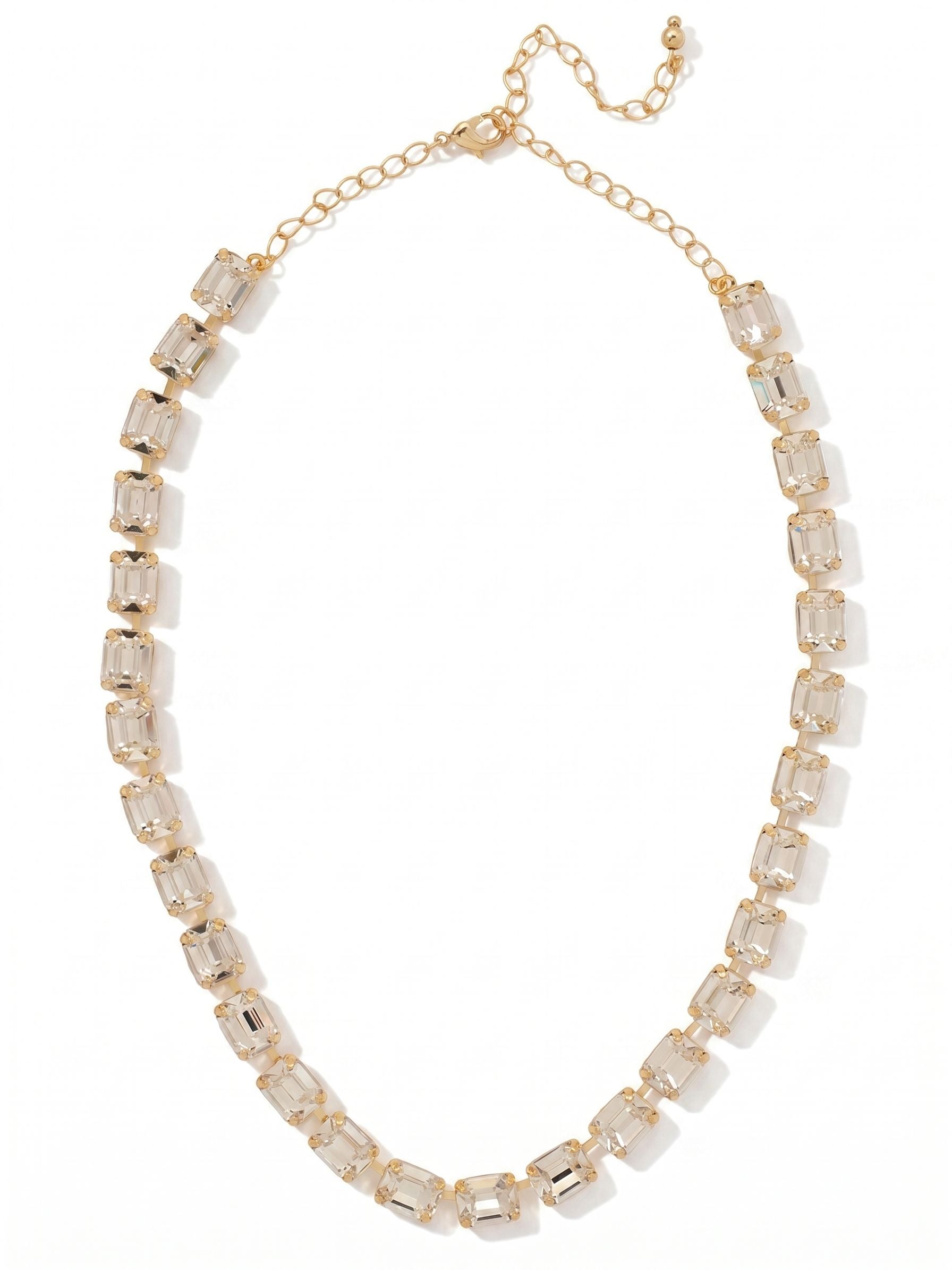 Octavia Repeating Tennis Necklace - NFY7BGCRY - <p>The Octavia Repeating Tennis Necklace features a full line of mini emerald-cut crystals with a 4 inch adjustable extension chain, secured with a lobster claw clasp. (16-20 inches)</p>