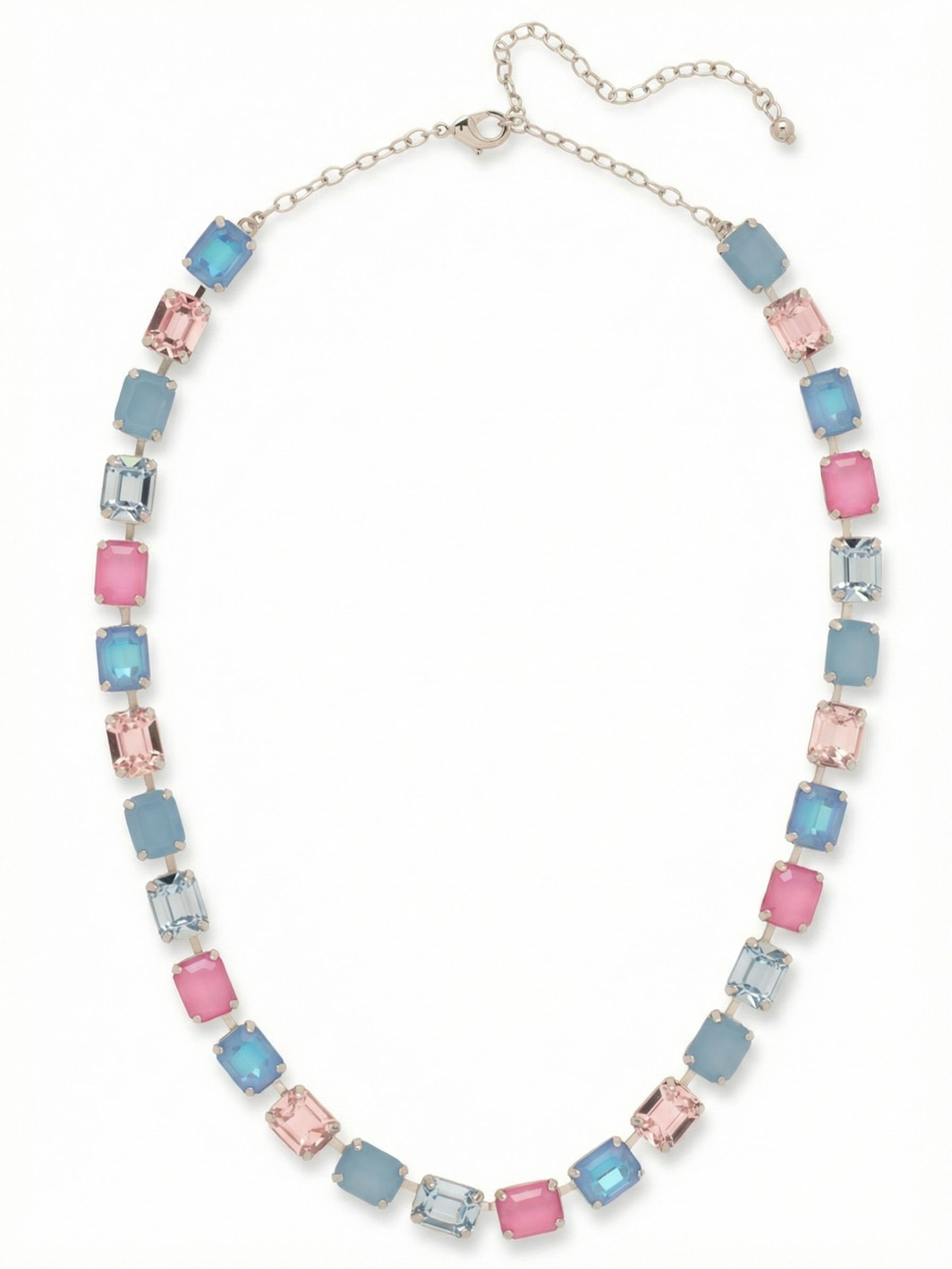 Octavia Repeating Tennis Necklace - NFY7PDPBZ - <p>An unbroken line of emerald-cut crystals creates a cool, rhythmic palette of soft blues, teals, and pale rose. Set tightly together in a specialized channel chain, the uniform rectangular stones form a fluid band of color that conforms naturally to the collarbone. Instead of scattering light, the broad step-cut facets catch it in steady, even flashes as you move. An adjustable extension lets you drop the length exactly where you want it, easily anchoring the open collar of a silk blouse or resting higher on the neck.</p><ul>
<li>Stepped facets of the emerald-cut stones catch light cleanly along the neckline</li>
<li>Fluid channel chain construction allows the continuous crystal line to drape organically</li>
<li>Lobster claw clasp</li>
<li>4-inch adjustable extension chain</li>
<li>Protective e-coat finish for lasting wear</li>
<li>Includes signature organza pouch for gifting and travel</li>
</ul>