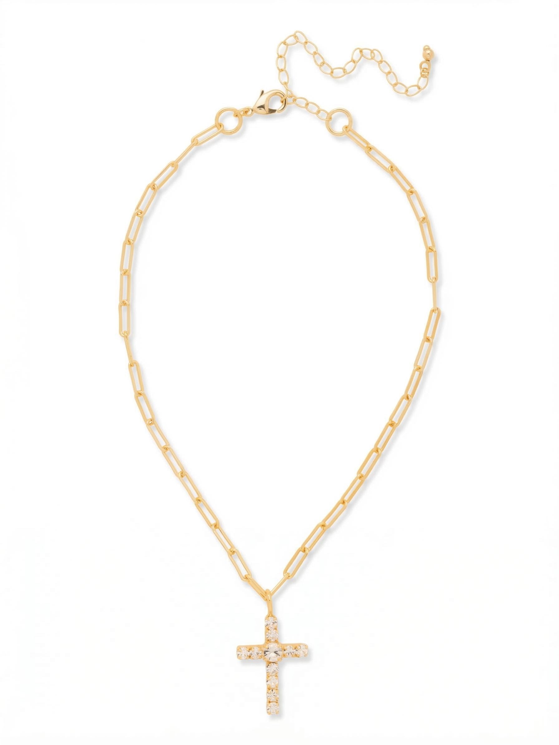 Cross Paperclip Pendant Necklace - NFZ11BGCRY - <p>A quiet balance of modern chainwork and classic crystal placement. The paperclip chain brings an open texture that feels incredibly light against the skin, catching a subtle gleam as you move. At the center rests a traditional cross pendant, anchored by a prominent clear crystal and outlined by ten smaller stones. The adjustable extension allows you to find the exact drape at your collarbone, making it easy to mix with heavier chains or wear entirely on its own.</p><ul>
<li>Open paperclip chain links create a lightweight and modern texture along the neckline</li>
<li>A prominent center crystal gracefully anchors the ten smaller stones shaping the cross design</li>
<li>Lobster claw clasp</li>
<li>4-inch adjustable extension chain</li>
<li>Protective e-coat finish for lasting wear</li>
<li>Includes signature organza pouch for gifting and travel</li>
</ul>