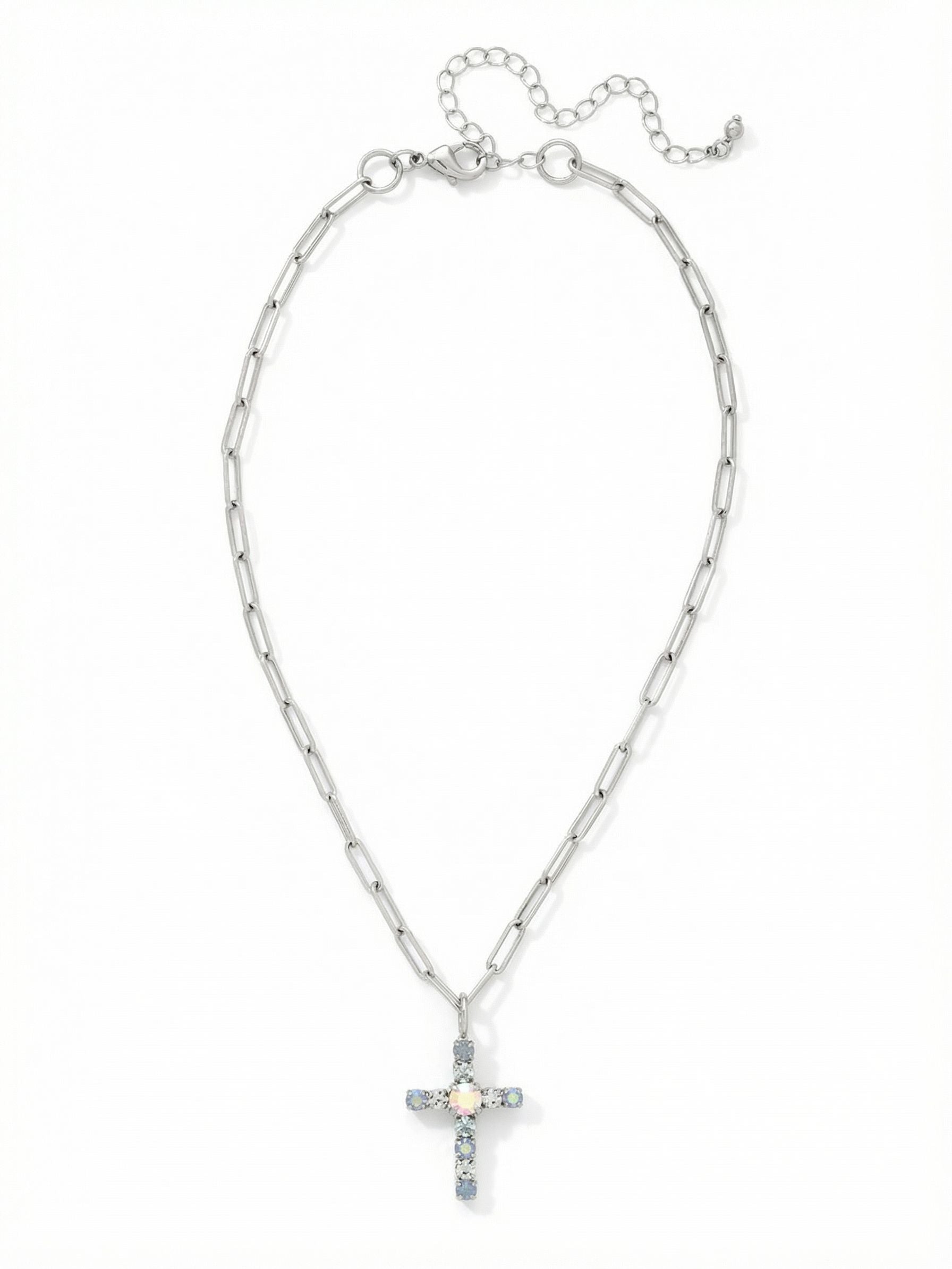 Cross Paperclip Pendant Necklace - NFZ11PDRQ - <p>A modern take on a classic silhouette. The clean lines of the palladium paperclip chain offer a sleek contrast to the soft opalescent and icy blue crystals forming the cross pendant. As it moves with you, subtle shifts of pale azore and iridescent light radiate from the center stone. The necklace rests comfortably along the collarbone and includes an extension chain, making it an easy piece to layer with longer strands or wear simply on its own.</p><ul>
<li>Clean paperclip chain construction creates a modern visual contrast</li>
<li>A mix of pale azore and opal crystals emits a soft iridescent glow</li>
<li>Lobster claw clasp</li>
<li>4-inch adjustable extension chain</li>
<li>Protective e-coat finish for lasting wear</li>
<li>Includes signature organza pouch for gifting and travel</li>
</ul>