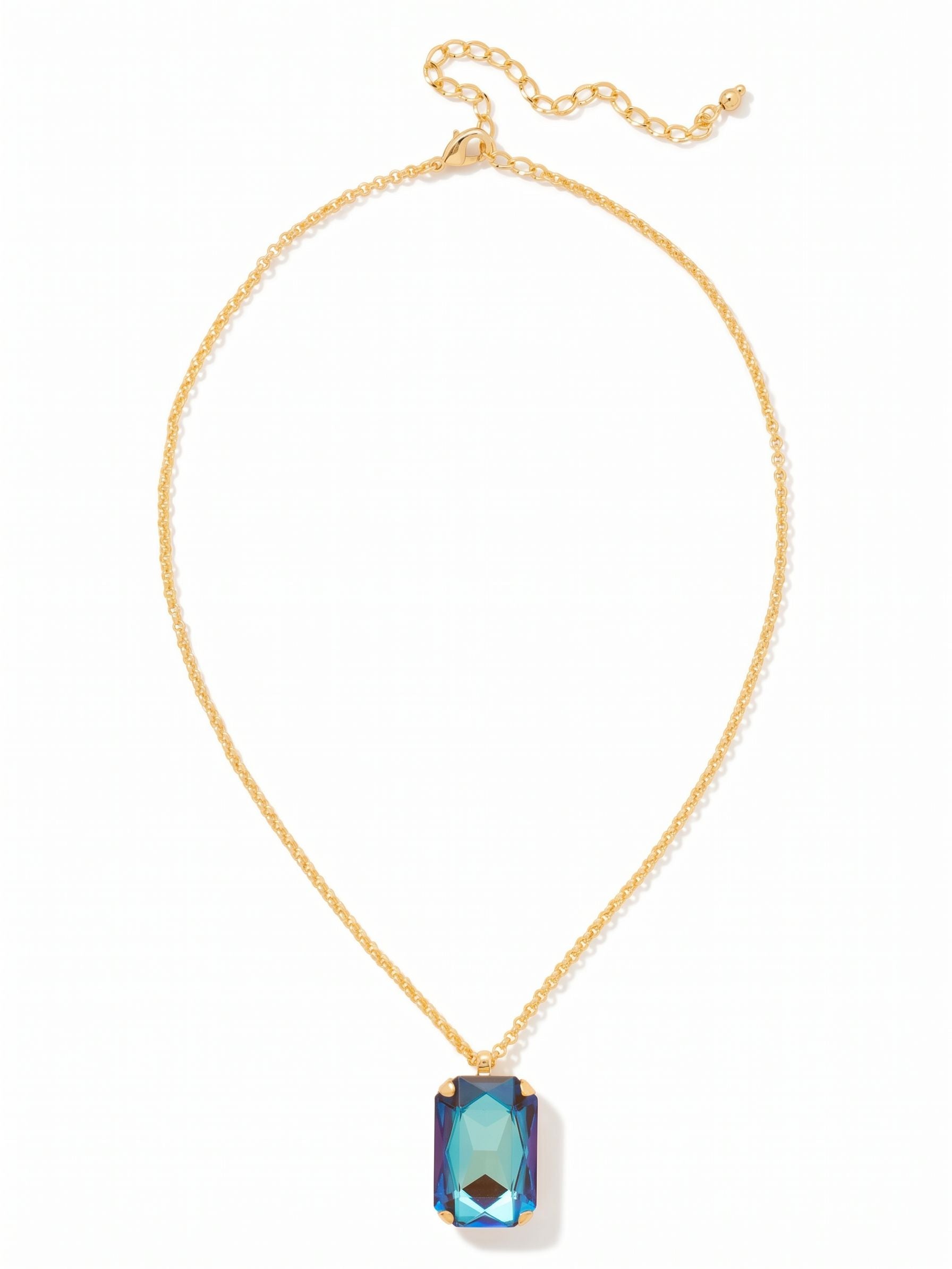 Viretta Pendant Necklace - NFZ16BGCPD - <p>A single, substantial emerald-cut crystal anchors this piece, bringing a grounded weight that centers your look. The faceted surface catches light with every movement, revealing warm, shifting tones of mocha and iridescent blue. Suspended from a slender rolo chain, the pendant rests comfortably near the collarbone. A built-in extension chain lets you adjust the length, offering the flexibility to layer it easily or let it stand alone over an open neckline.</p><ul>
<li>Oversized emerald-cut crystal creates a bold focal point</li>
<li>Slender rolo chain offers a delicate contrast to the heavy pendant</li>
<li>Lobster claw clasp</li>
<li>4-inch adjustable extension chain</li>
<li>Protective e-coat finish for lasting wear</li>
<li>Includes signature organza pouch for gifting and travel</li>
</ul>