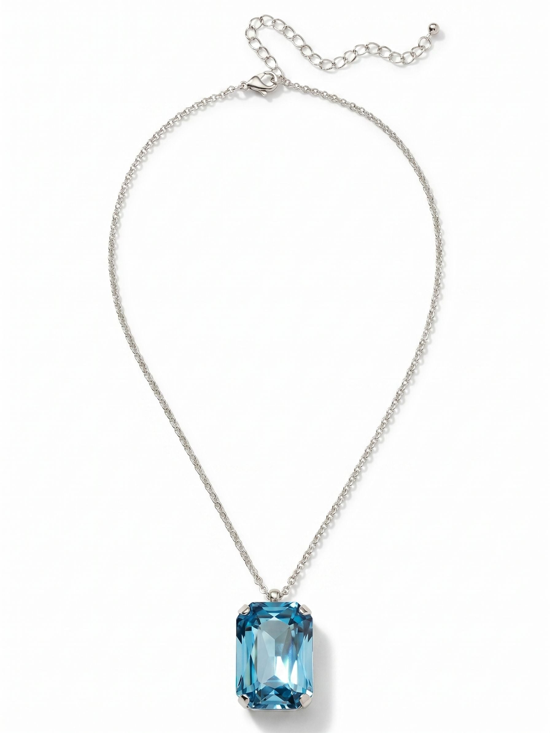 Viretta Pendant Necklace - NFZ16PDAQU - <p>A single, substantial aquamarine crystal anchors this pendant. Cut in a classic emerald shape, the step facets draw light deep into the stone, creating bright flashes of icy blue as you move.</p><ul>
<li>Substantial emerald-cut crystal with geometric step facets</li>
<li>Delicate interlocking rolo chain balances the pendant scale</li>
<li>Lobster claw clasp</li>
<li>4-inch adjustable extension chain</li>
<li>Protective e-coat finish for lasting wear</li>
<li>Includes signature organza pouch for gifting and travel</li>
</ul>