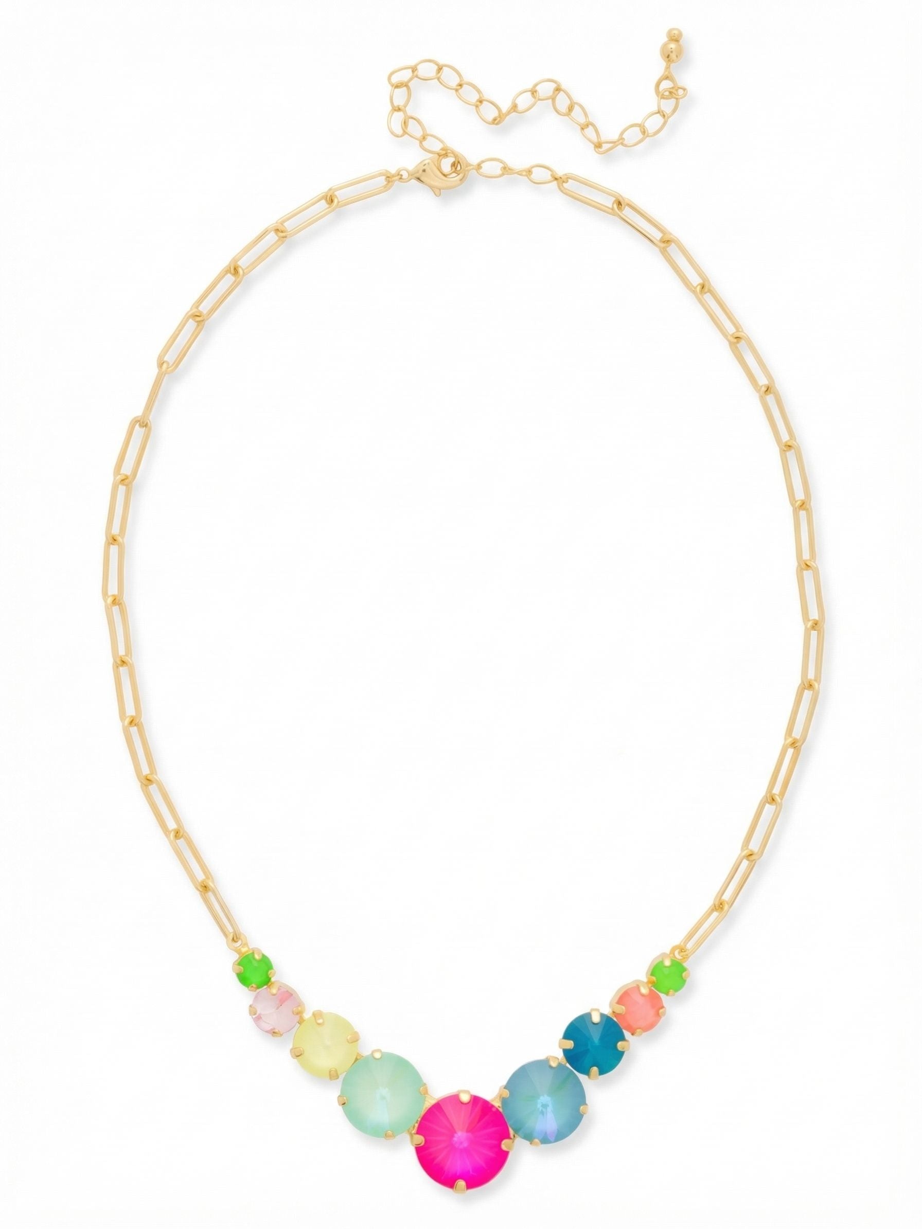 Calista Tennis Necklace - NFZ1BGCCA - <p>An open paperclip chain transitions into a vibrant sweep of nine faceted crystals centered right at the collarbone. The graduated stone sequence anchors the piece, offering enough weight to keep the neon pink, mint, and Caribbean blue tones perfectly in place as you move. The open metal links keep the overall feel light and airy, while the extension chain lets you adjust the drop to suit an open collar or a high neckline.</p><ul>
<li>Graduated crystal arrangement keeps the weight centered</li>
<li>Open paperclip links balance the visual density of the front-facing stones</li>
<li>Lobster claw clasp</li>
<li>4-inch adjustable extension chain</li>
<li>Protective e-coat finish for lasting wear</li>
<li>Includes signature organza pouch for gifting and travel</li>
</ul>