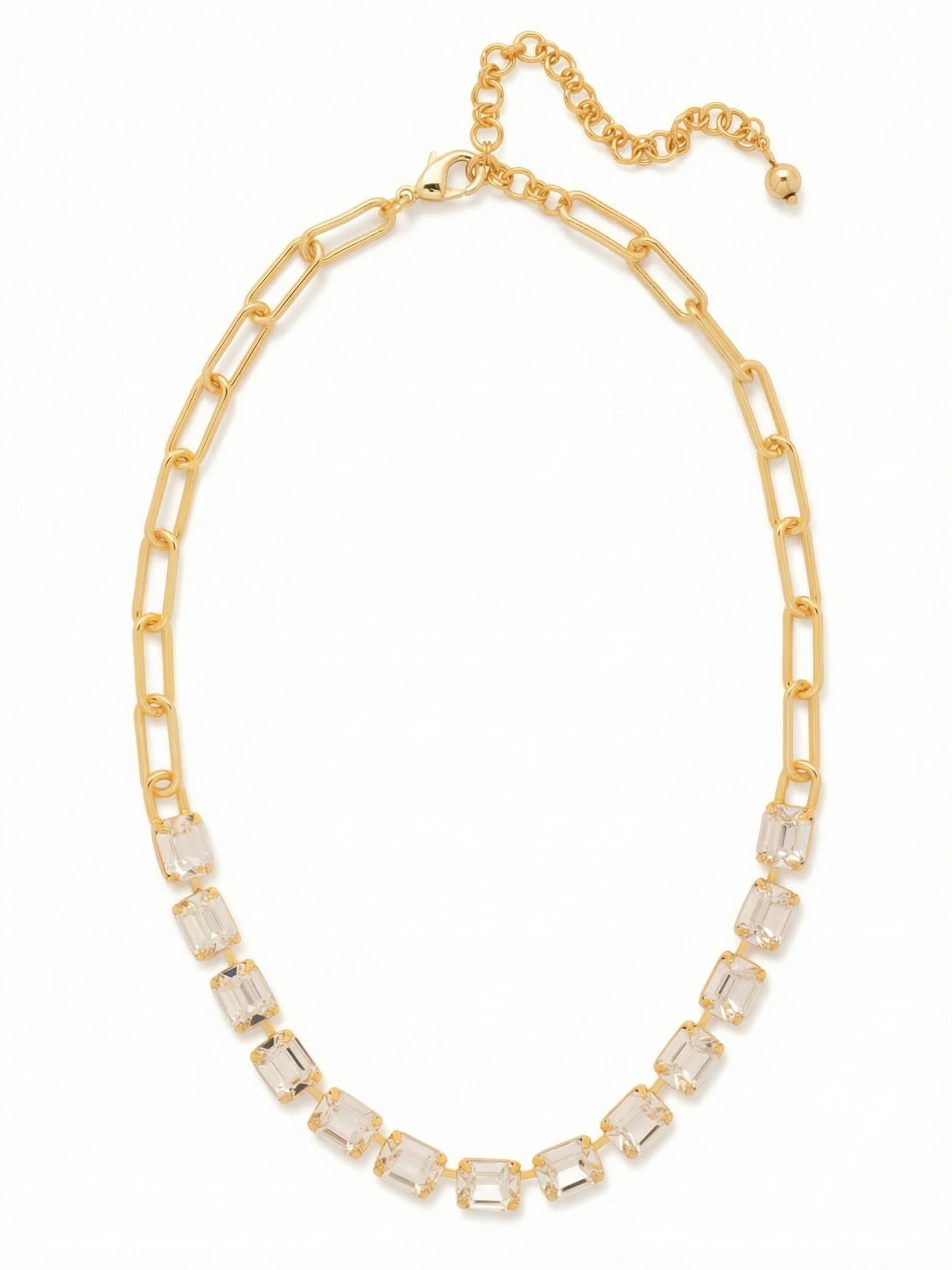 Octavia Paperclip Tennis Necklace - NFZ3BGCRY - <p>A modern play on contrasting textures. A front arc of emerald-cut clear crystals catches the light with clean, architectural lines before transitioning into an airy paperclip chain in bright gold-tone. The open links give the necklace a relaxed drape along the collarbone. It brings a calculated geometry to your neckline that holds its own worn solo, while the included extension chain lets you adjust the drop to layer easily with finer pieces.</p><ul>
<li>Front-facing channel of step-cut crystals creates clean architectural lines</li>
<li>Open-link paperclip chain offers a relaxed and modern drape</li>
<li>Lobster claw clasp</li>
<li>4-inch adjustable extension chain</li>
<li>Protective e-coat finish for lasting wear</li>
<li>Includes signature organza pouch for gifting and travel</li>
</ul>