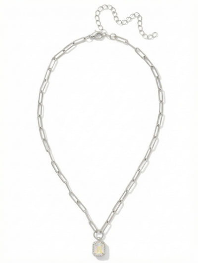 Octavia Scalloped Pendant Necklace - NGA1PDCAB - <p>A solitary emerald-cut crystal anchors this piece. Its iridescent surface shifts softly as it catches the light. The pendant is framed by a delicate scalloped edge, bringing subtle texture to the clean lines of the stone. It hangs from an airy paperclip chain that drapes easily across the collarbone. The elongated links feel modern and light, balancing the iridescent focal point. An adjustable extension chain lets you shift the length to layer seamlessly with your everyday necklaces.</p><ul>
<li>Solitary emerald-cut crystal framed by a textured scalloped setting</li>
<li>Airy paperclip chain with elongated oval links</li>
<li>Lobster claw clasp</li>
<li>4-inch adjustable extension chain</li>
<li>Protective e-coat finish for lasting wear</li>
<li>Includes signature organza pouch for gifting and travel</li>
</ul>