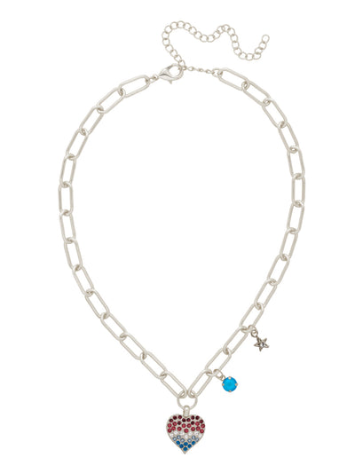 Pave Heart Charm Pendant Necklace - NGB7PDUSA - <p>Add a touch of sparkle and romance to your look with our Pavé Heart Charm Pendant Necklace.</p><p>This statement piece features a shimmering heart charm encrusted with crystals, gracefully anchored at the base of a bold, adjustable paperclip chain. Delicately placed above the heart are two eye-catching accents—a round-cut crystal charm and a star charm adorned with dazzling pavé crystals—adding layered brilliance to every angle. (16-20 inches) From Sorrelli's Stars and Stripes collection in our Palladium finish.</p>