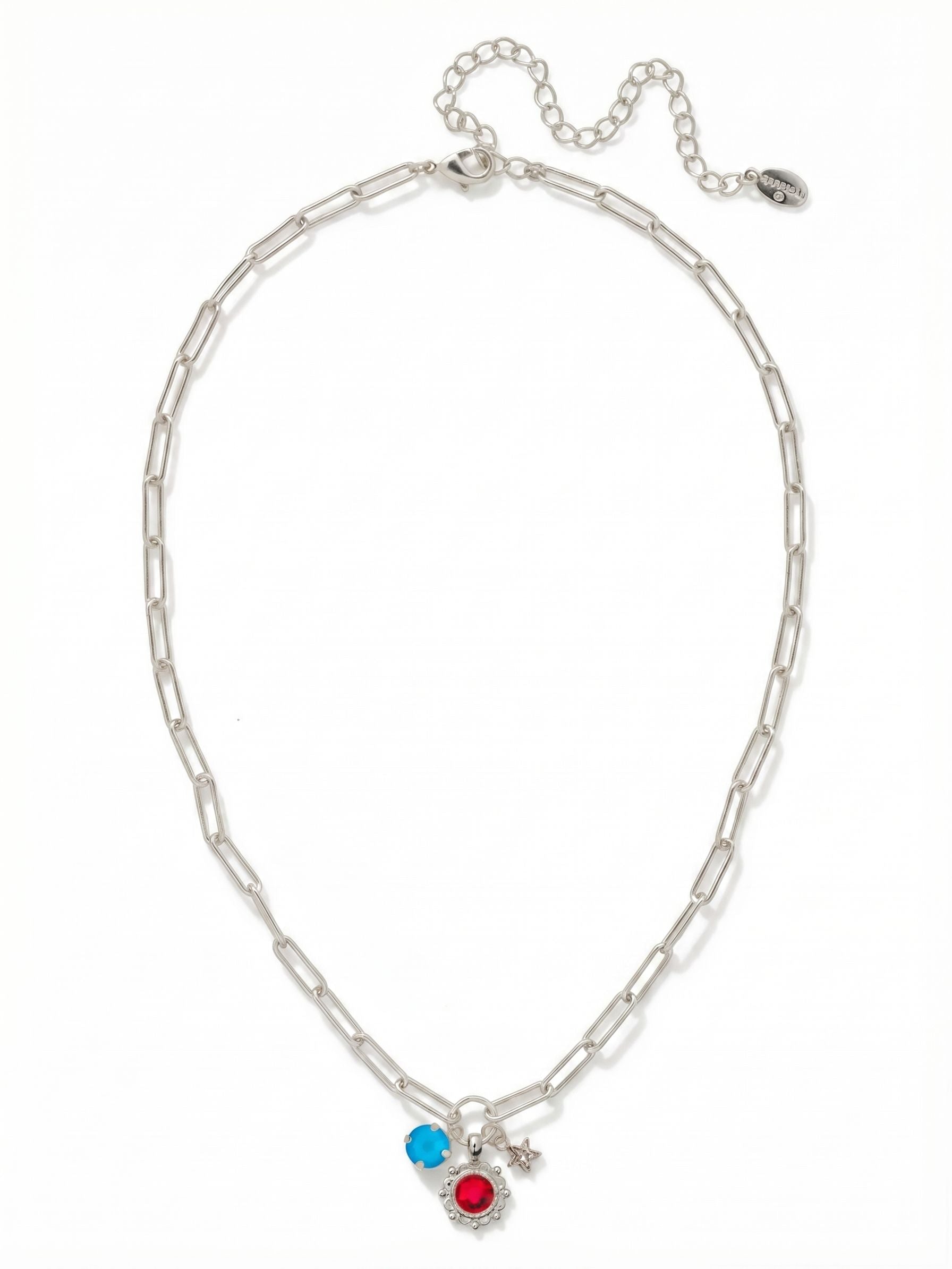 Liberty Charm Pendant Necklace - NGB9PDUSA - <p>The Liberty Charm Pendant Necklace features a cluster of three charms: a single round-cut crystal, a crystal-embellished flower, and a crystal-embellished star-- on an adjustable paperclip chain, secured by a lobster claw clasp. (16-20 inches)</p>