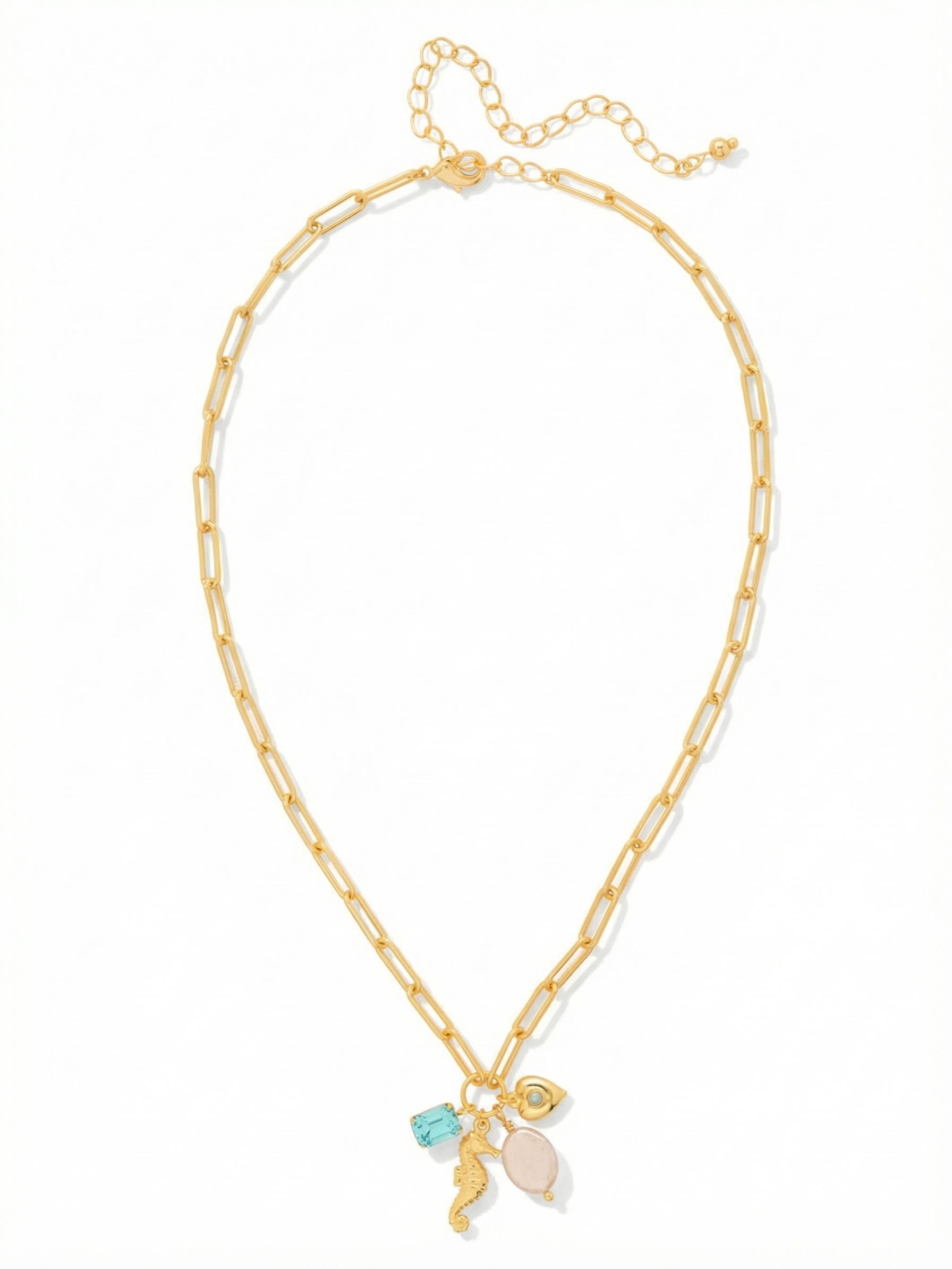 Seahorse Charm Pendant Necklace - NGE5BGCSD - <p>An airy paperclip chain suspends a gathered cluster of seaside textures right at the collarbone. An emerald-cut aquamarine crystal catches the light alongside a smooth pearlescent bead, a finely detailed seahorse, and a small heart charm. The individual pieces shift and settle as you move, creating a subtle visual rhythm. Built with an adjustable extension chain to control the drape, this necklace stands easily on its own over a linen shirt or layers seamlessly with simple chains.</p><ul>
<li>Airy paperclip chain provides a modern lightweight foundation</li>
<li>Clustered mix of crystals, pearls, and coastal charms</li>
<li>Lobster claw clasp</li>
<li>4-inch adjustable extension chain</li>
<li>Protective e-coat finish for lasting wear</li>
<li>Includes signature organza pouch for gifting and travel</li>
</ul>