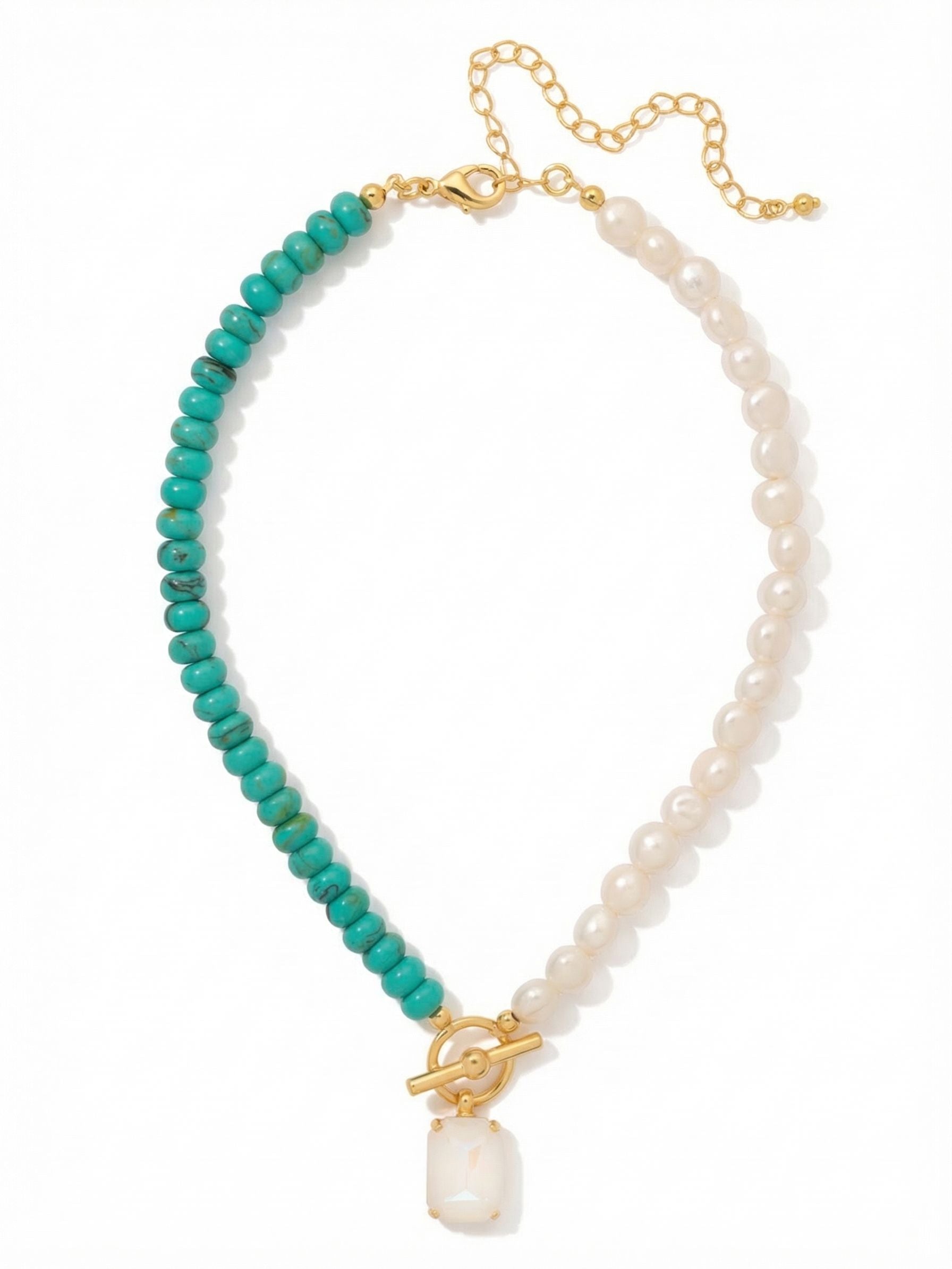 Isle of Palms Pendant Necklace - NGE7BGTQ - <p>An unexpected balance of natural texture and sharp geometry. One side lines up the smooth coolness of turquoise green rondelles, while the other strings the organic warmth of white baroque pearls. The two halves meet at the collarbone, anchored by a substantial emerald-cut crystal that catches the light with a soft iridescent glow. The varied weight of the beads provides a comforting substance against the skin, and the adjustable chain lets you place the pendant exactly where it feels right.</p><ul>
<li>Asymmetrical beaded design contrasting turquoise green rondelles with baroque pearls</li>
<li>Centered by a decorative ring and an oversized emerald-cut crystal pendant</li>
<li>Lobster claw clasp</li>
<li>4-inch adjustable extension chain</li>
<li>Protective e-coat finish for lasting wear</li>
<li>Includes signature organza pouch for gifting and travel</li>
</ul>