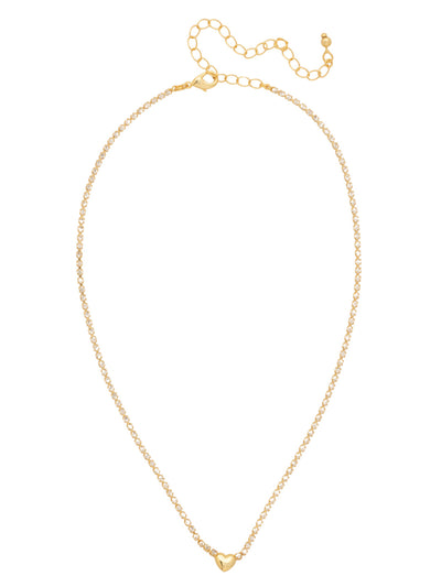 Mini Marnie Heart Tennis Necklace - NGF6BGCRY - <p>Embrace minimalist romance with the Mini Marnie Heart Tennis Necklace, centering a petite metallic heart on a delicate, crystal strand. An adjustable chain ensures this subtle staple fits perfectly, whether worn solo or layered. (16-20 inches) From Sorrelli's Crystal collection in our Bright Gold-tone finish.</p>