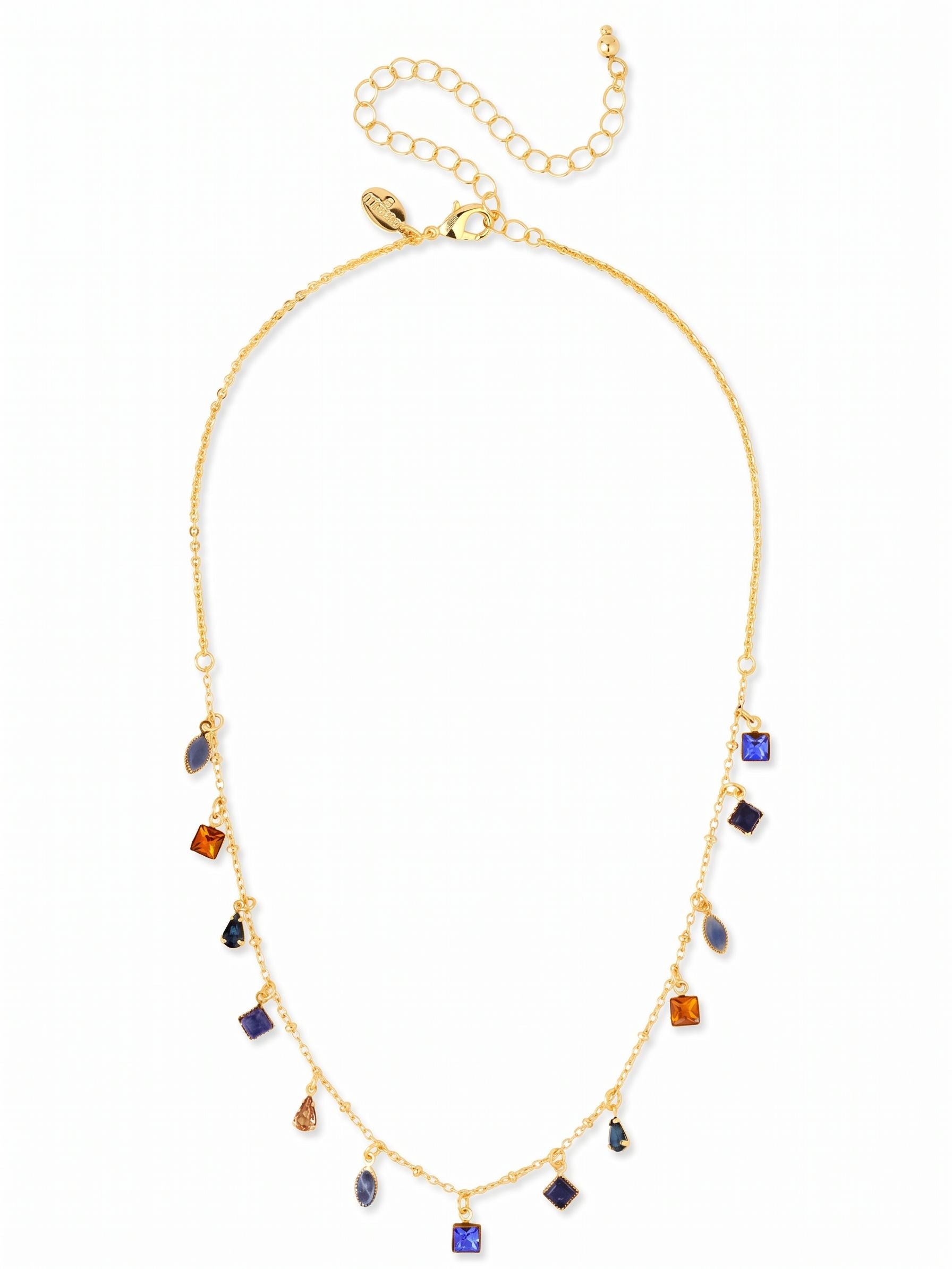 Indie Tennis Necklace - NGI3BGDNM - <p>Thirteen small crystals drop delicately from a fine gold-tone chain, creating a gentle rhythm of deep blue and warm amber tones along the collarbone. The mix of square, pear, and marquise cuts catches the light with a quiet, constant motion throughout the day. Finished with an extension chain, this piece adjusts easily to sit perfectly over a bare neckline or layer neatly below a shorter collar.</p><ul>
<li>Delicate station design with evenly spaced dangling crystals</li>
<li>Mix of square, pear, and marquise stones in alternating colors</li>
<li>Lobster claw clasp</li>
<li>4-inch adjustable extension chain</li>
<li>Protective e-coat finish for lasting wear</li>
<li>Includes signature organza pouch for gifting and travel</li>
</ul>