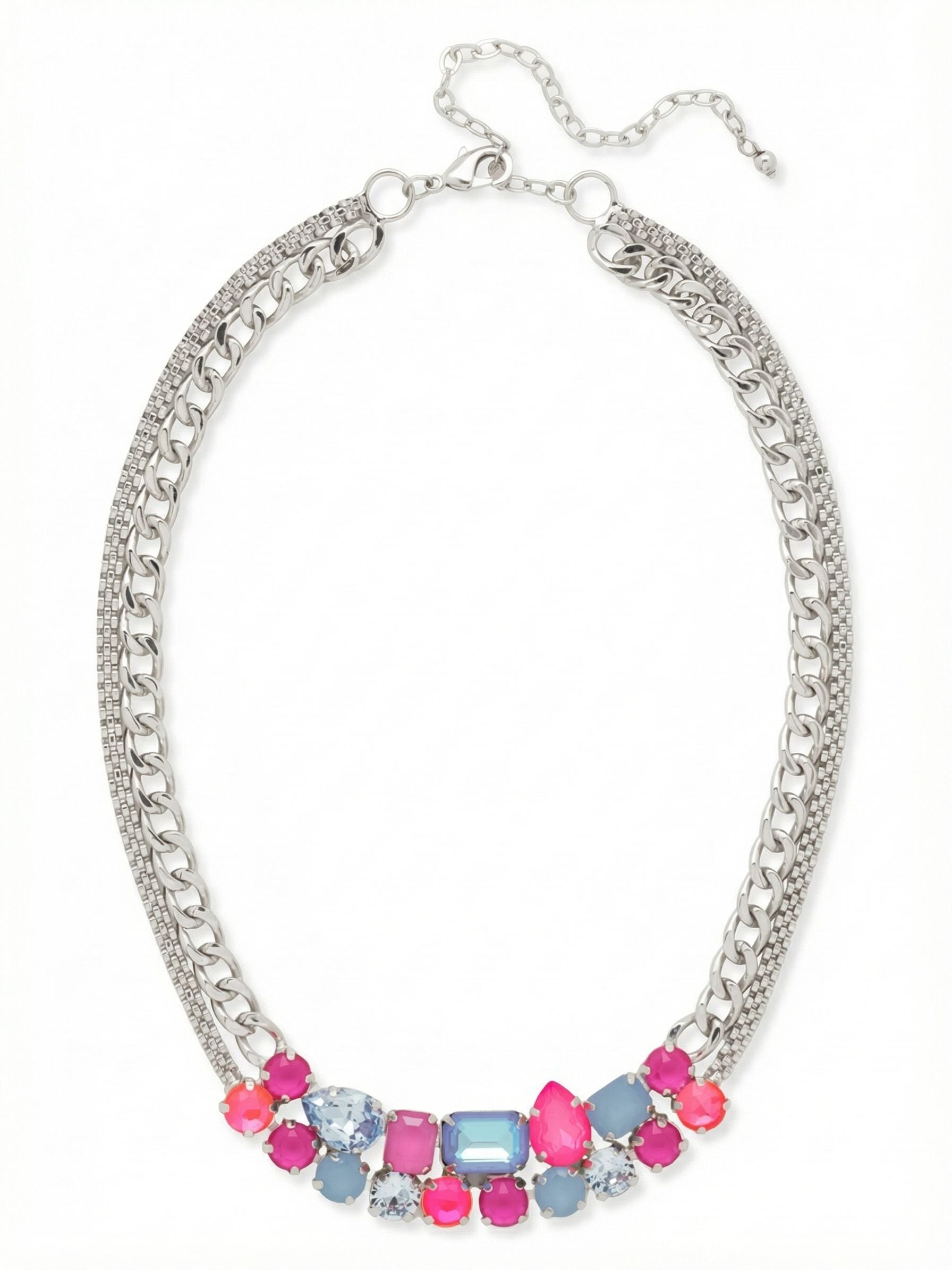 Moxie Tennis Necklace - NGI4PDPBZ - <p>Vibrant pink and soft blue crystals gather in a dense cluster at the collarbone, creating a deliberate focal point of mixed geometric cuts. This colorful arrangement is balanced by the substantial drape of a layered metal foundation combining a textured mesh chain with classic cable links. The asymmetrical stone placement gives the piece a distinct edge while remaining highly wearable. An included four-inch extension lets you adjust the length, ensuring the weighted center rests comfortably along your neckline.</p><ul>
<li>Concentrated asymmetrical cluster of multi-cut crystals</li>
<li>Substantial double-strand foundation combining mesh and cable chains</li>
<li>Lobster claw clasp</li>
<li>Protective e-coat finish for lasting wear</li>
<li>Includes signature organza pouch for gifting and travel</li>
</ul>