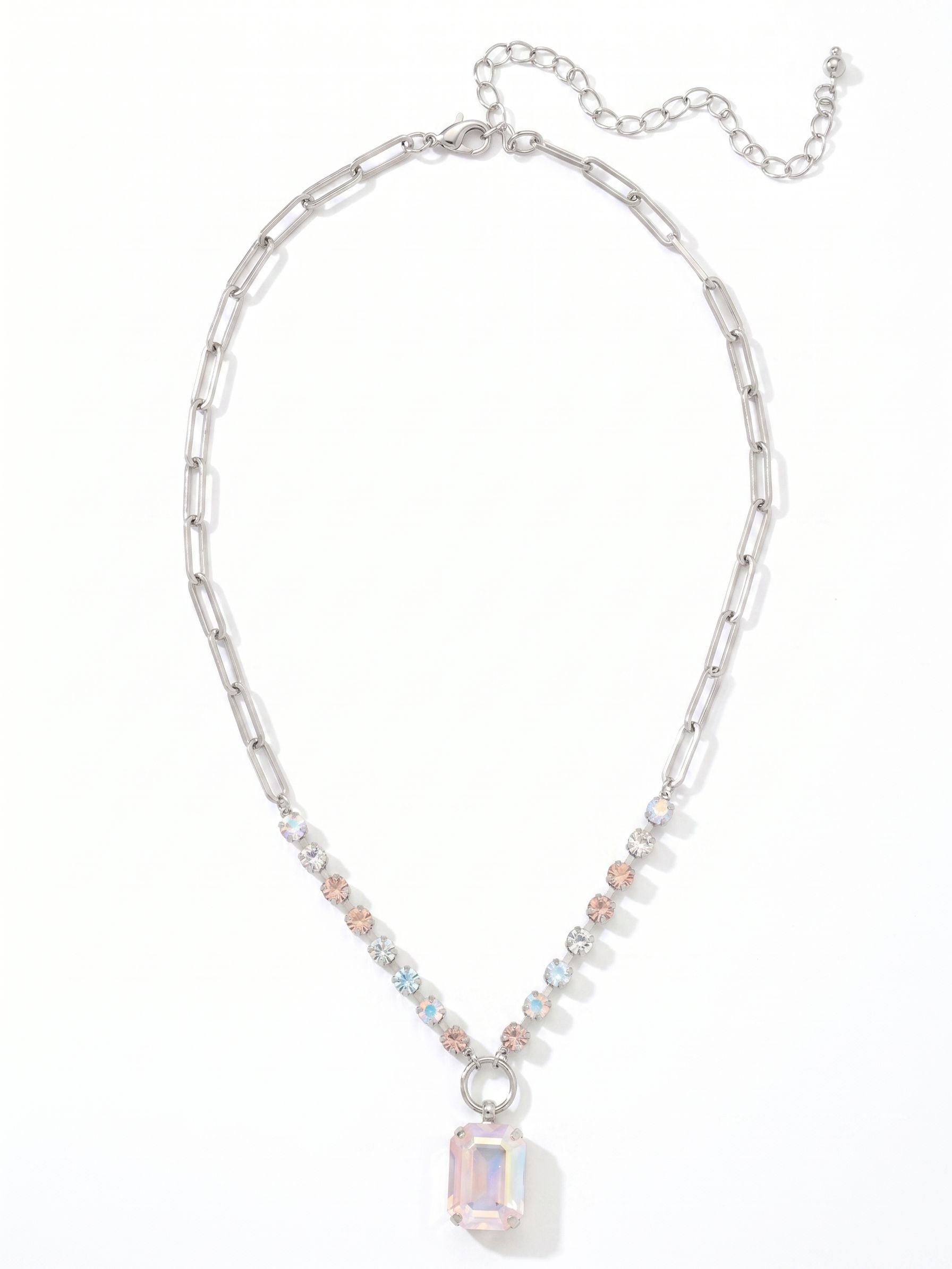 Iris Pendant Necklace - NGI50PDRQ - <p>A prominent emerald-cut crystal anchors the design, drawing light through its broad facets. It hangs from a mixed chain that balances the airy feel of paperclip links with a structured row of crystal-set channel chain. Soft shades of pale blue, vintage rose, and clear crystal create a subtle prism effect near the collarbone. The built-in extension chain allows you to adjust the drop precisely to your neckline, making it easy to layer or wear alone.</p><ul>
<li>Mixed chain design pairing airy paperclip links with a crystal-studded sections</li>
<li>Prominent emerald-cut center stone framed by soft pastel rounds</li>
<li>Lobster claw clasp</li>
<li>4-inch adjustable extension chain</li>
<li>Protective e-coat finish for lasting wear</li>
<li>Includes signature organza pouch for gifting and travel</li>
</ul>