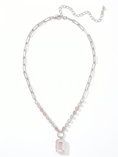 Iris Pendant Necklace - NGI50PDRQ - <p>A prominent emerald-cut crystal anchors the design, drawing light through its broad facets. It hangs from a mixed chain that balances the airy feel of paperclip links with a structured row of crystal-set channel chain. Soft shades of pale blue, vintage rose, and clear crystal create a subtle prism effect near the collarbone. The built-in extension chain allows you to adjust the drop precisely to your neckline, making it easy to layer or wear alone.</p><ul>
<li>Mixed chain design pairing airy paperclip links with a crystal-studded sections</li>
<li>Prominent emerald-cut center stone framed by soft pastel rounds</li>
<li>Lobster claw clasp</li>
<li>4-inch adjustable extension chain</li>
<li>Protective e-coat finish for lasting wear</li>
<li>Includes signature organza pouch for gifting and travel</li>
</ul>