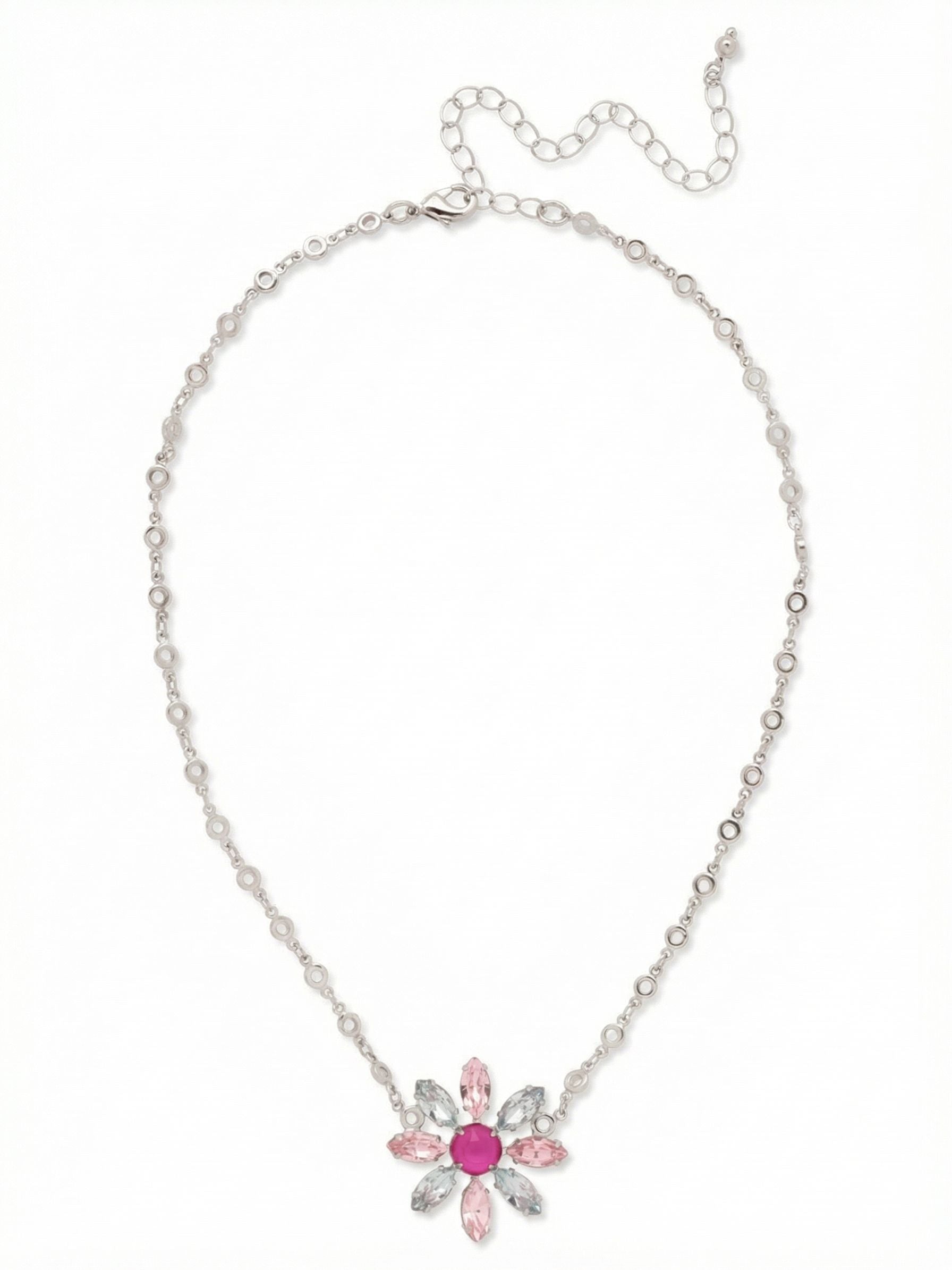 Cosmos Pendant Necklace - NGI6PDPBZ - <p>A vivid peony pink crystal centers this botanical pendant, framed by alternating blush rose and icy sapphire petals. The piece is fixed directly to a distinctive circular link chain, keeping the floral motif perfectly centered as you move through your day. The built-in extension lets you adjust the drape, allowing the starburst to hit right where you want it above an open collar or a simple crewneck. It brings a crisp, refreshing wash of color to your daily uniform.</p><ul>
<li>Starburst motif formed by alternating pastel marquise crystals around a vivid round center</li>
<li>Distinctive circular link chain keeps the overall design visually light and airy</li>
<li>Lobster claw clasp</li>
<li>4-inch adjustable extension chain</li>
<li>Protective e-coat finish for lasting wear</li>
<li>Includes signature organza pouch for gifting and travel</li>
</ul>