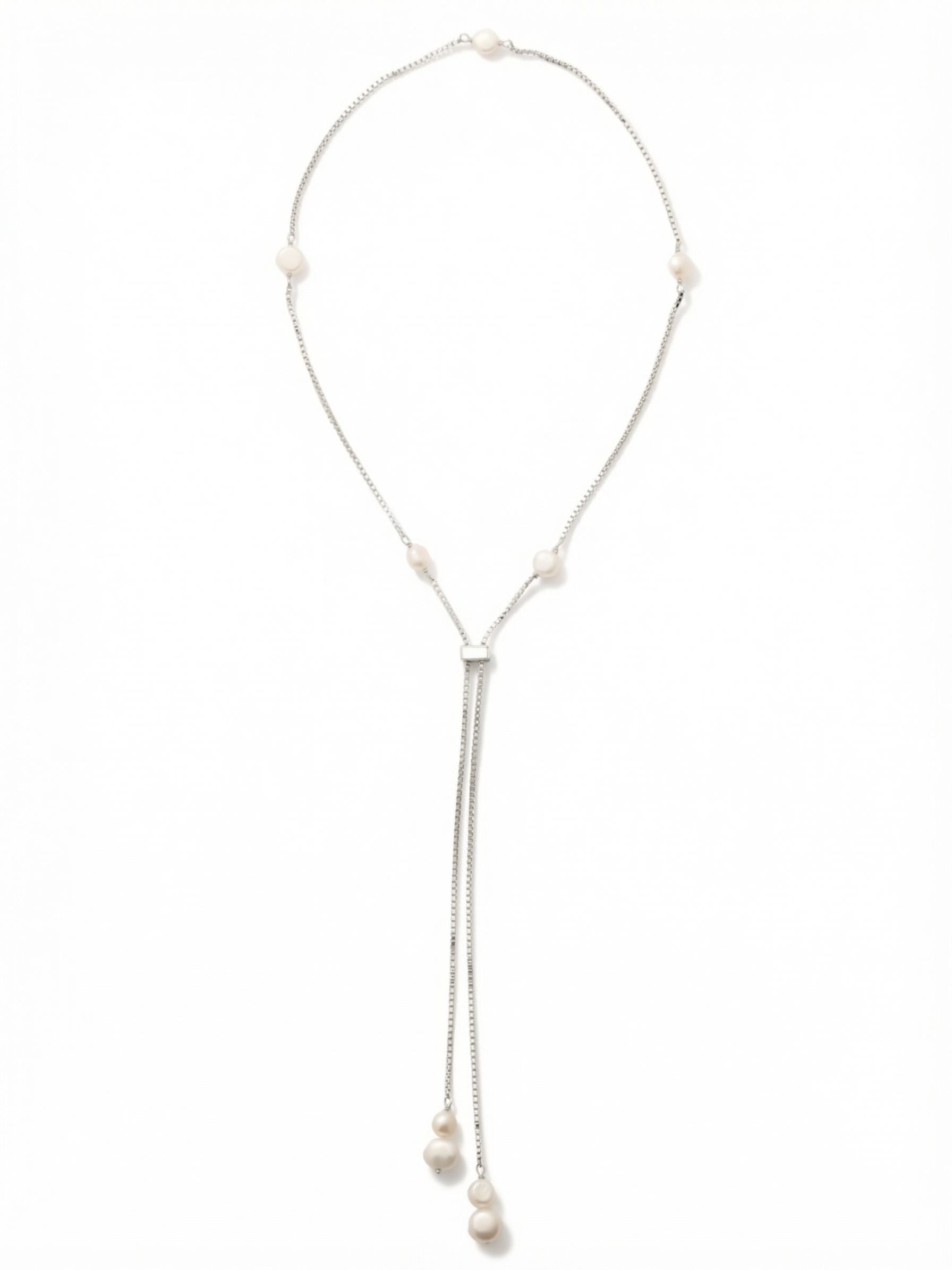Winnie Long Necklace - NGJ3PDCRY - <p>A fine box chain drapes fluidly down the neckline, lightly punctuated by softly rounded white pearls. The sliding mechanism transforms the silhouette entirely, letting you wear it as a long open strand or pull it into a plunging lariat shape. The weighted baroque pearl drops at the ends anchor the chain, giving the necklace a subtle sway as you walk. It layers cleanly over high necklines and creates elegant lines against bare skin.</p><ul>
<li>Fluid box chain that drapes seamlessly</li>
<li>Mixed pearl sizes create natural visual rhythm</li>
<li>Adjustable slider offers varied silhouettes</li>
<li>Protective e-coat finish for lasting wear</li>
<li>Includes signature organza pouch for gifting and travel</li>
</ul>