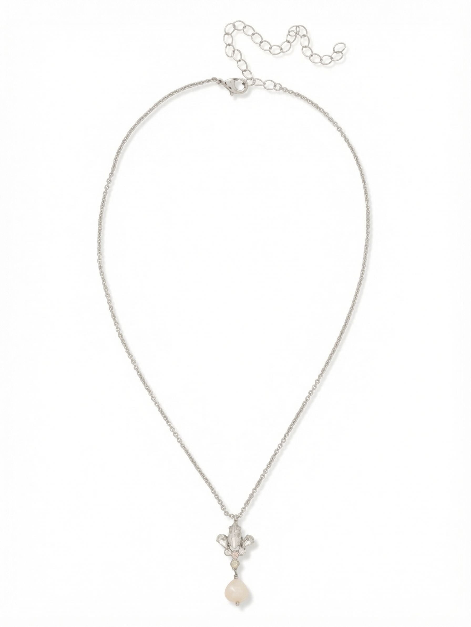 Tessa Pendant Necklace - NGJ4PDCLA - <p>A delicate cable chain anchors a gathered arrangement of clear, faceted crystals, drawing the eye down to a single luminous pearl drop. The mix of marquise and pear cuts catches light with every subtle shift in posture, creating a soft, textural focal point right at the collarbone. Complete with an extension chain to easily adjust the drape, this pendant layers effortlessly with longer strands or stands quietly on its own against bare skin.</p><ul>
<li>Mixed marquise and pear crystals gathered above a smooth pearl drop</li>
<li>Suspended from a delicate cable chain that gracefully traces the collarbone</li>
<li>Lobster claw clasp</li>
<li>4-inch adjustable extension chain</li>
<li>Protective e-coat finish for lasting wear</li>
<li>Includes signature organza pouch for gifting and travel</li>
</ul>
