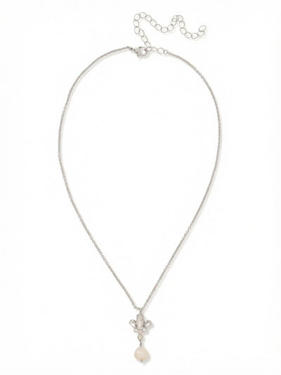 Tessa Pendant Necklace - NGJ4PDCLA - <p>A delicate cable chain anchors a gathered arrangement of clear, faceted crystals, drawing the eye down to a single luminous pearl drop. The mix of marquise and pear cuts catches light with every subtle shift in posture, creating a soft, textural focal point right at the collarbone. Complete with an extension chain to easily adjust the drape, this pendant layers effortlessly with longer strands or stands quietly on its own against bare skin.</p><ul>
<li>Mixed marquise and pear crystals gathered above a smooth pearl drop</li>
<li>Suspended from a delicate cable chain that gracefully traces the collarbone</li>
<li>Lobster claw clasp</li>
<li>4-inch adjustable extension chain</li>
<li>Protective e-coat finish for lasting wear</li>
<li>Includes signature organza pouch for gifting and travel</li>
</ul>