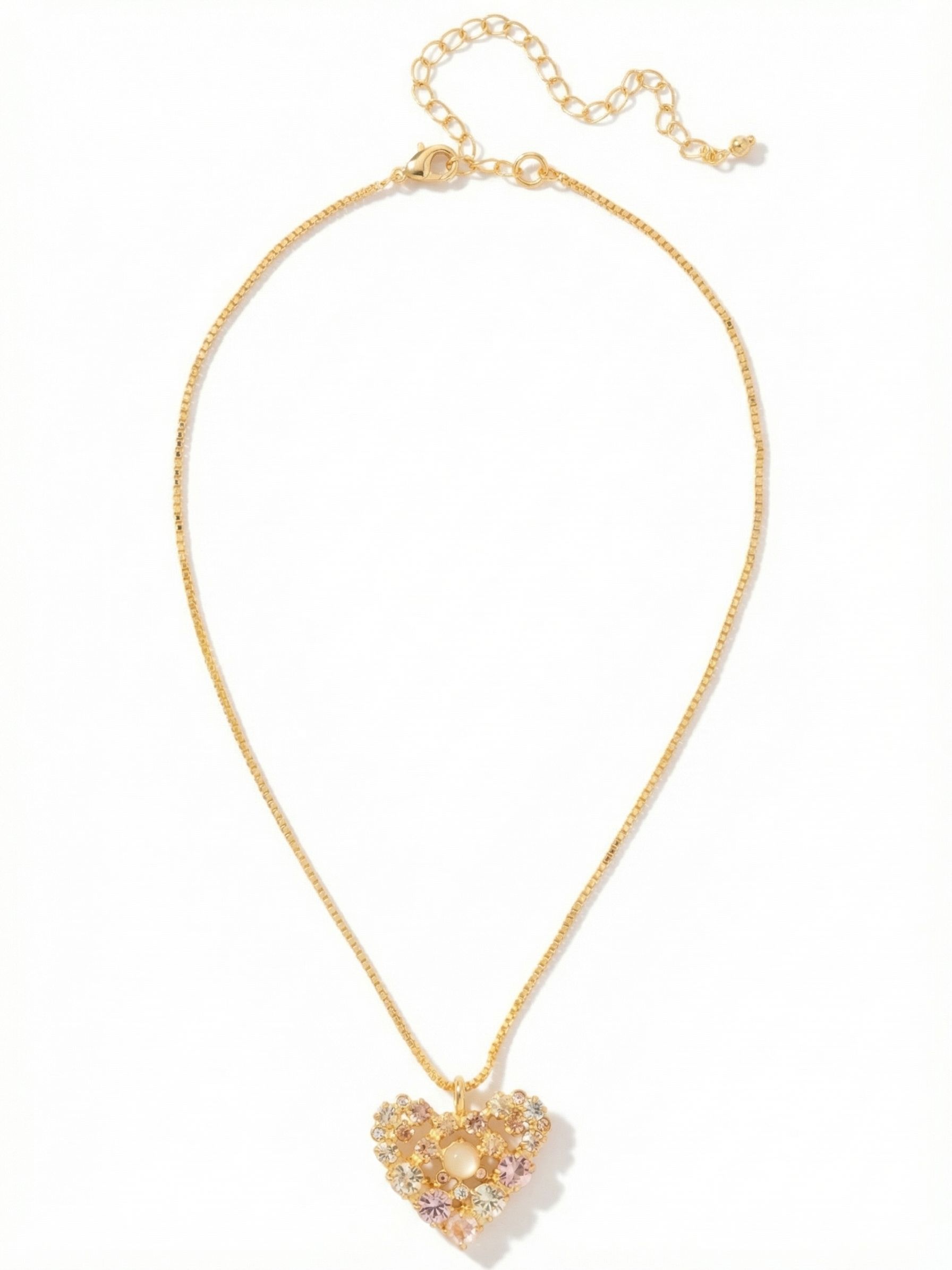 Crystal Heart Pendant Necklace - NGK2BGGGO - <p>Twenty-five individually set crystals form a delicate openwork heart suspended from a bright gold-tone box chain. The mix of warm champagne, soft silk, and vintage rose tones creates a subtle gradient of color that catches the light naturally as you move. The structured box chain keeps the pendant gracefully centered near your collarbone, while the extension chain lets you adjust the drop to accommodate varying necklines. It is a quiet, considered piece that feels instantly familiar.</p><ul>
<li>Intricate openwork heart design arranged from warm pink and champagne round-cut crystals</li>
<li>Fluid box chain construction offers a structured drape</li>
<li>Lobster claw clasp</li>
<li>4-inch adjustable extension chain</li>
<li>Protective e-coat finish for lasting wear</li>
<li>Includes signature organza pouch for gifting and travel</li>
</ul>